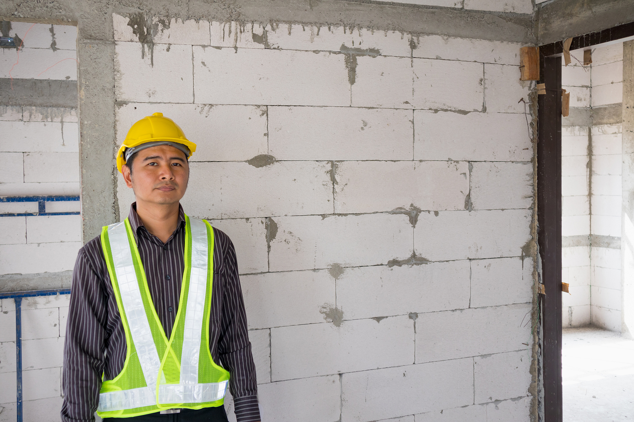 asian business man construction engineer worker at house buildin