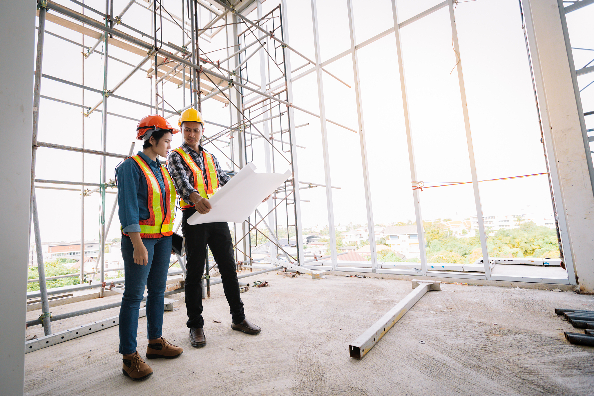 engineers are meeting and pointed to the plan building in the of