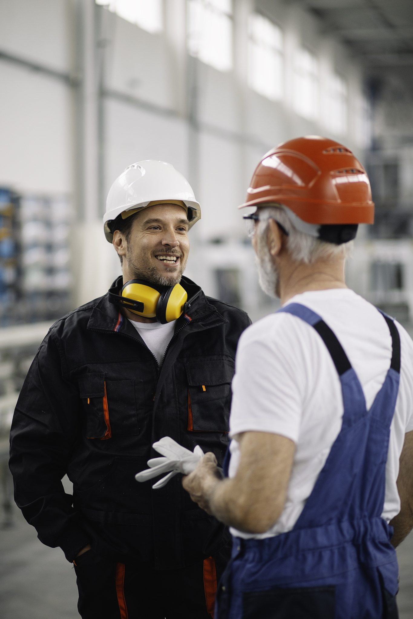 colleagues working together. workers in factory.