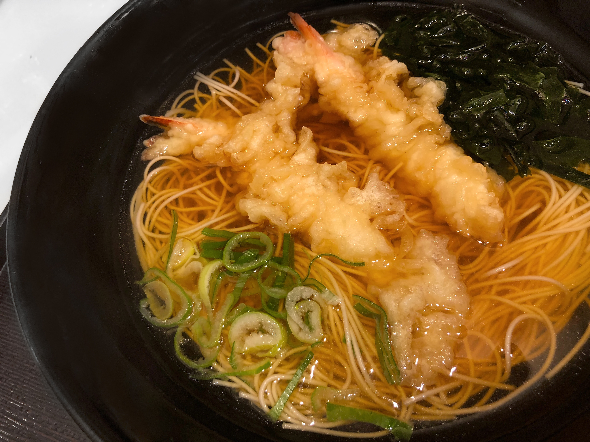 nyumen or hot somen noodles with shrimp tempura, seaweed and sli