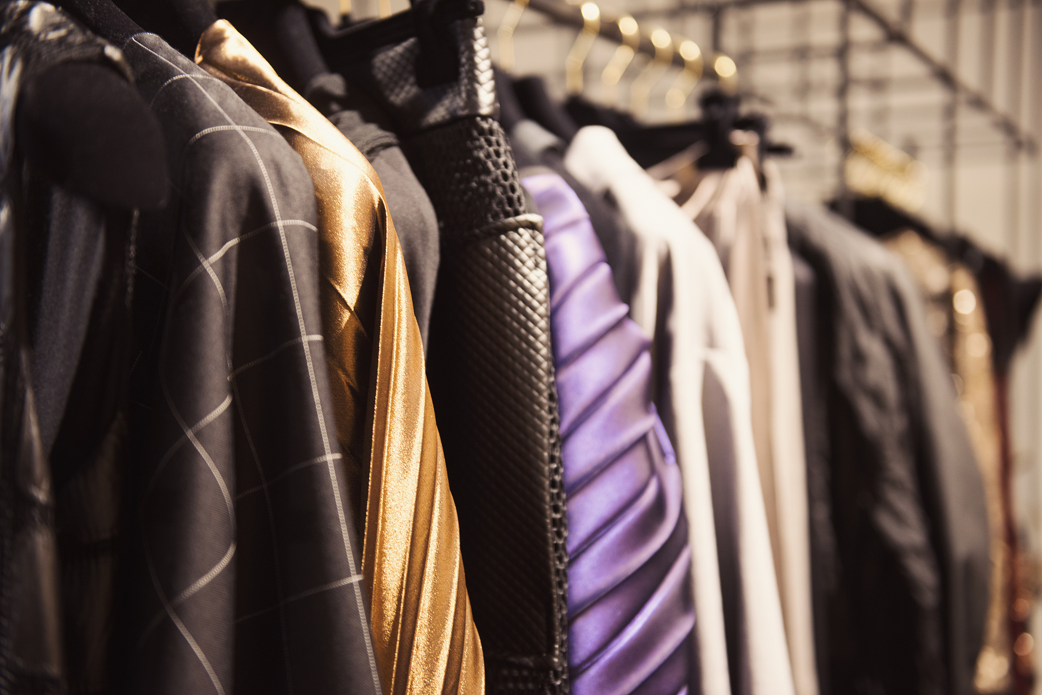 women clothing  in a retail shop. fashion and shopping concept.