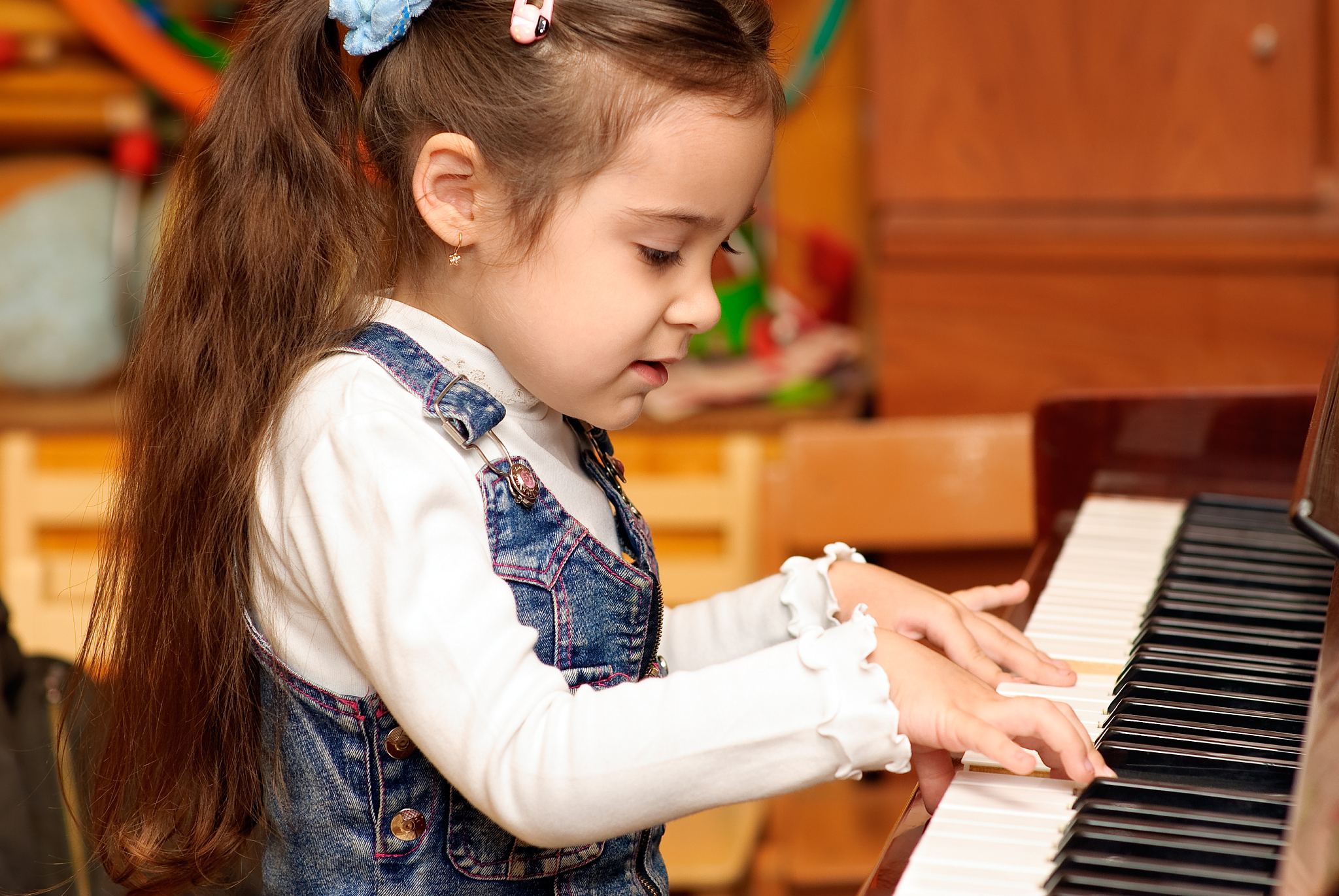 girl plays piano