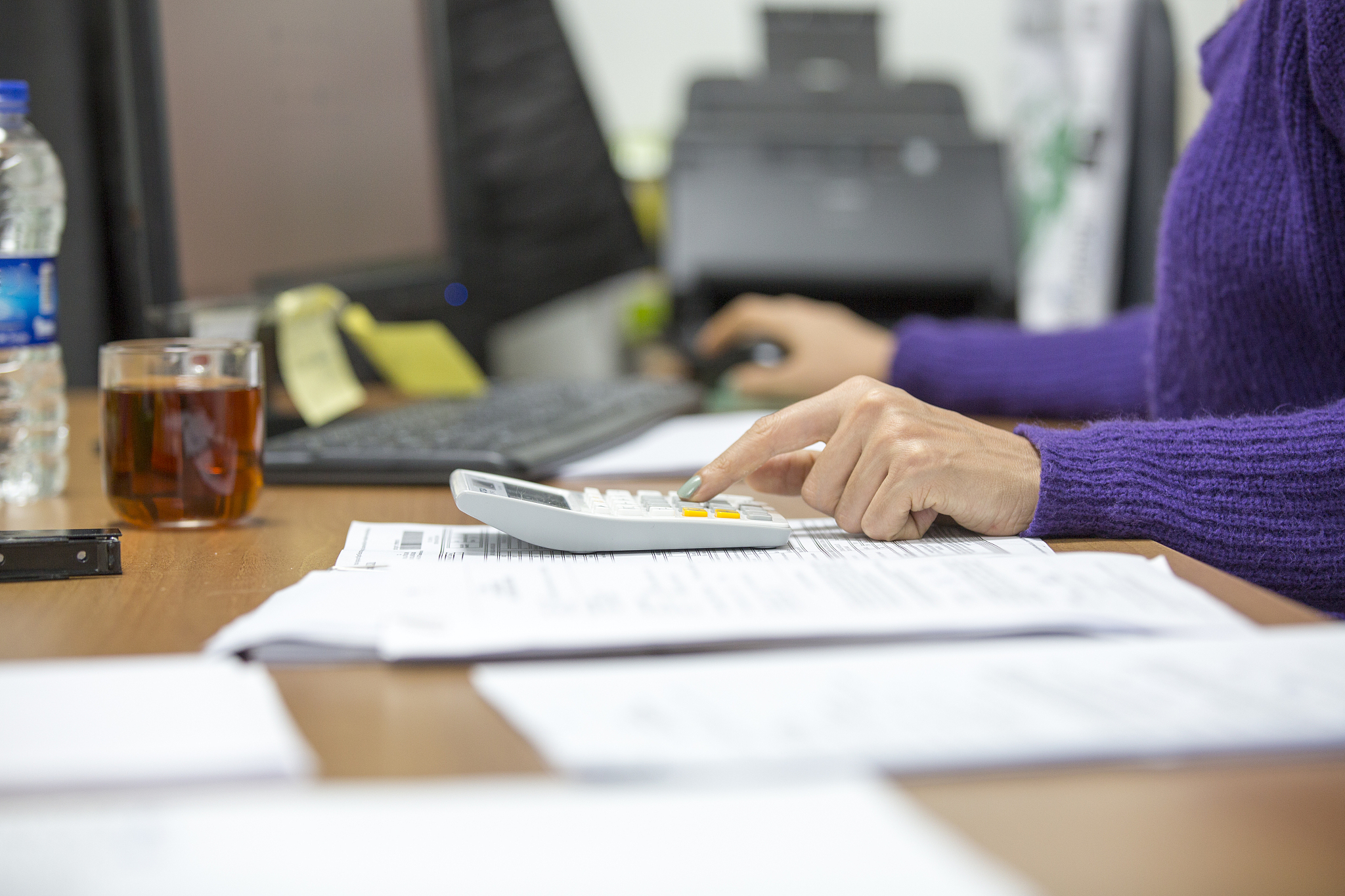 young woman working in an office. savings, finances and economy 
