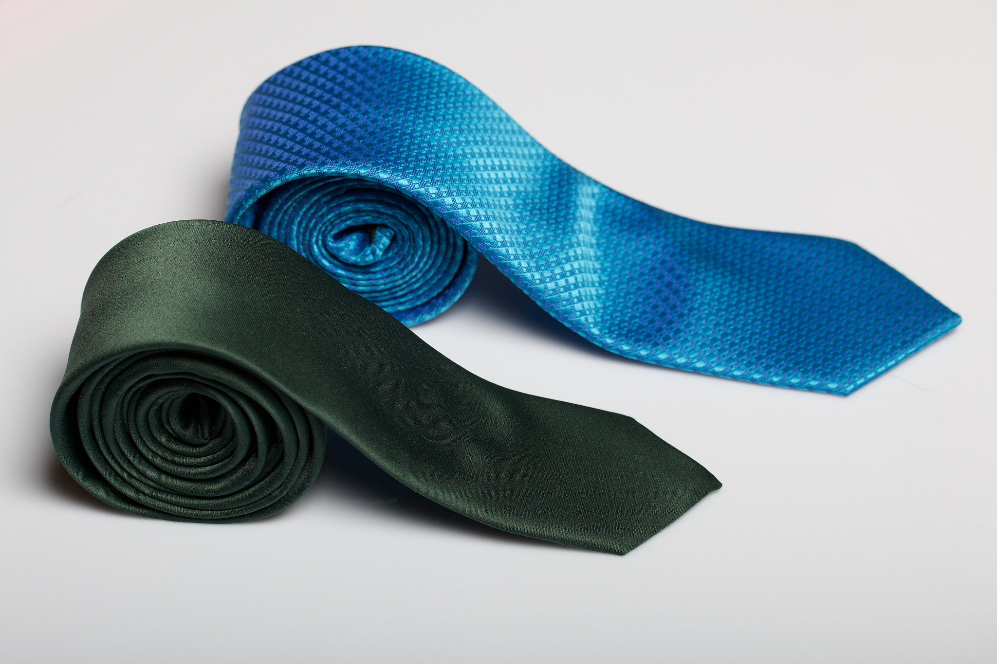 two men's ties in different colors and sizes. for father and son