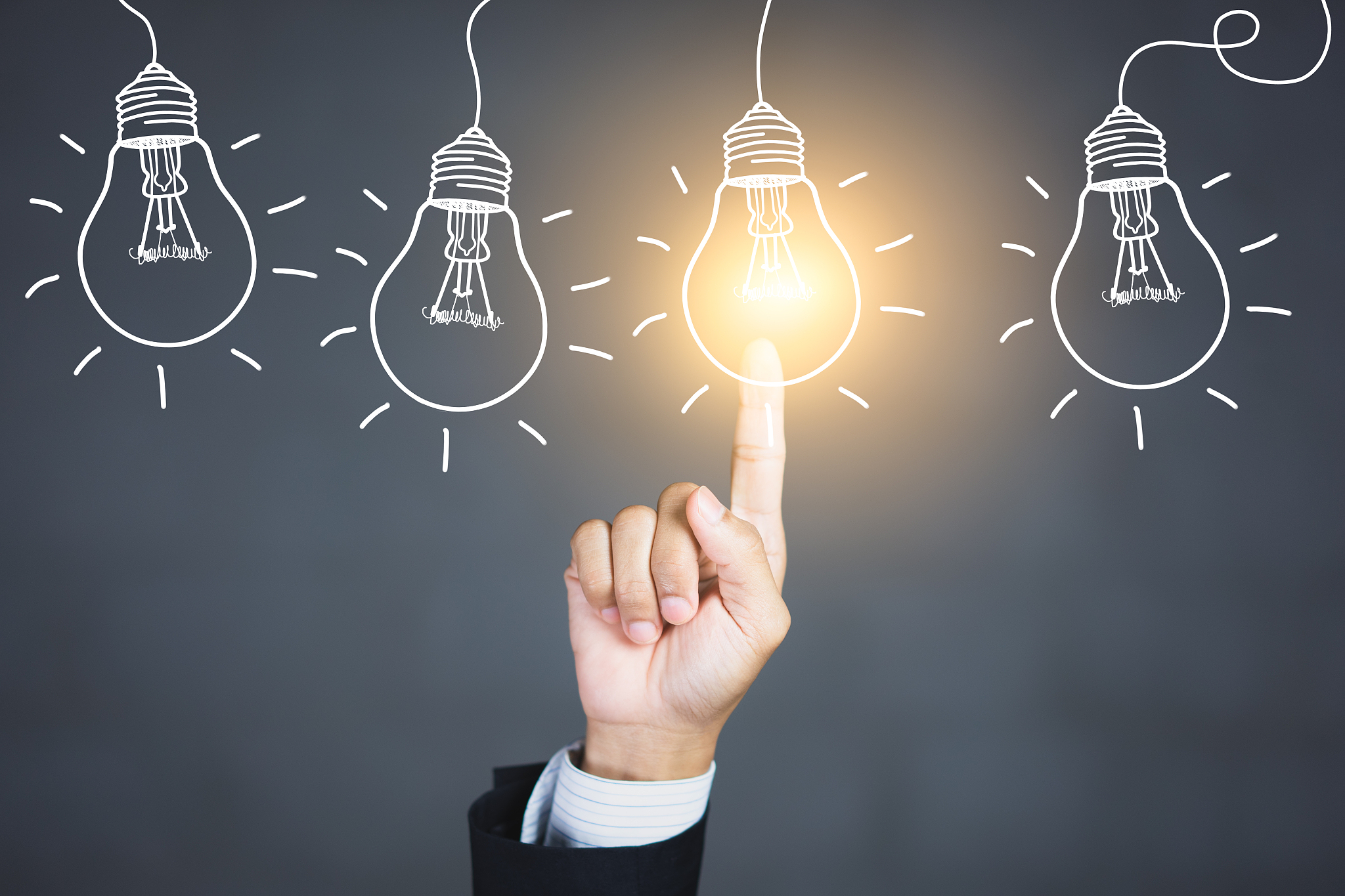 businessman hand touching light bulbs, new ideas with innovative