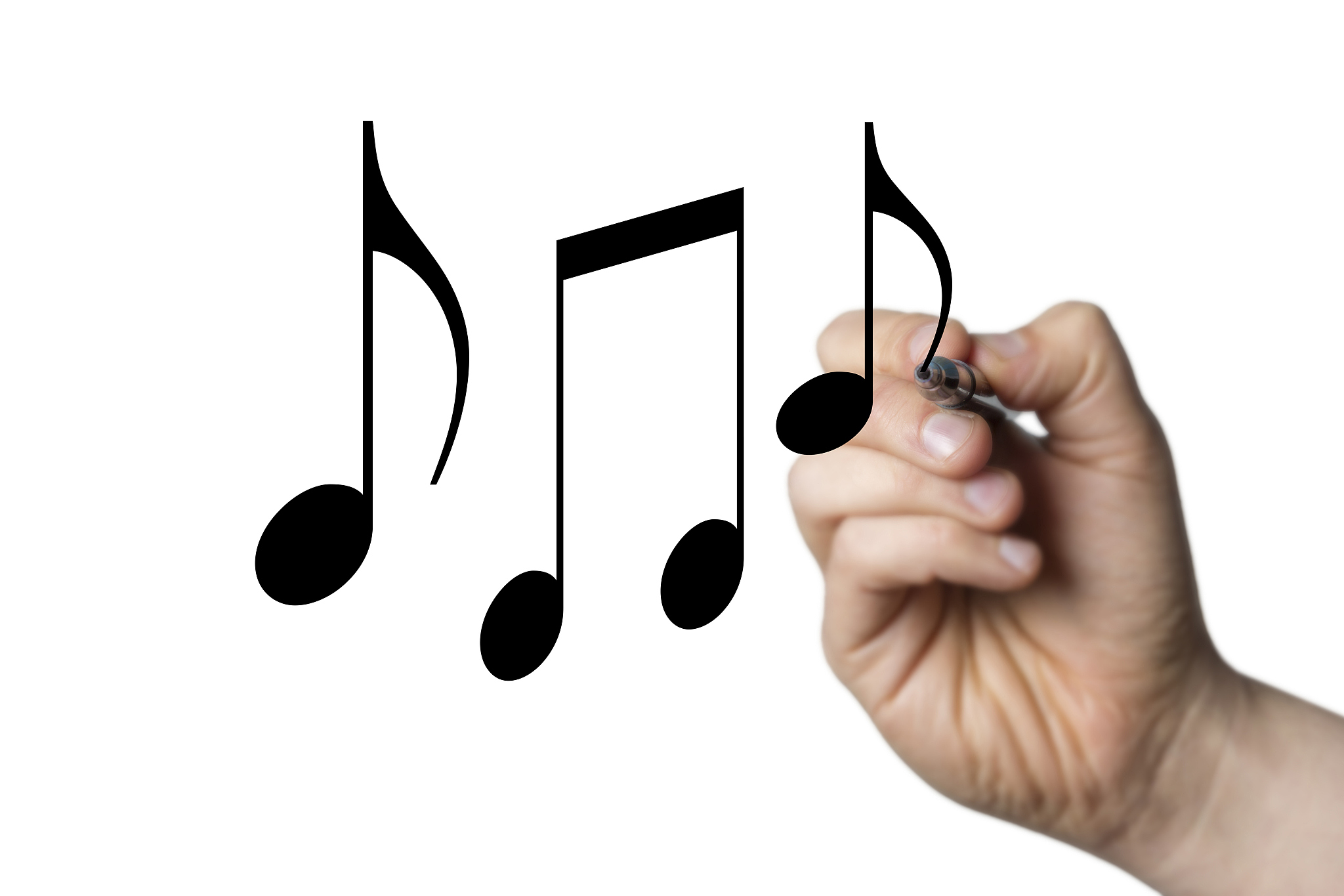 music notes drawn by a hand
