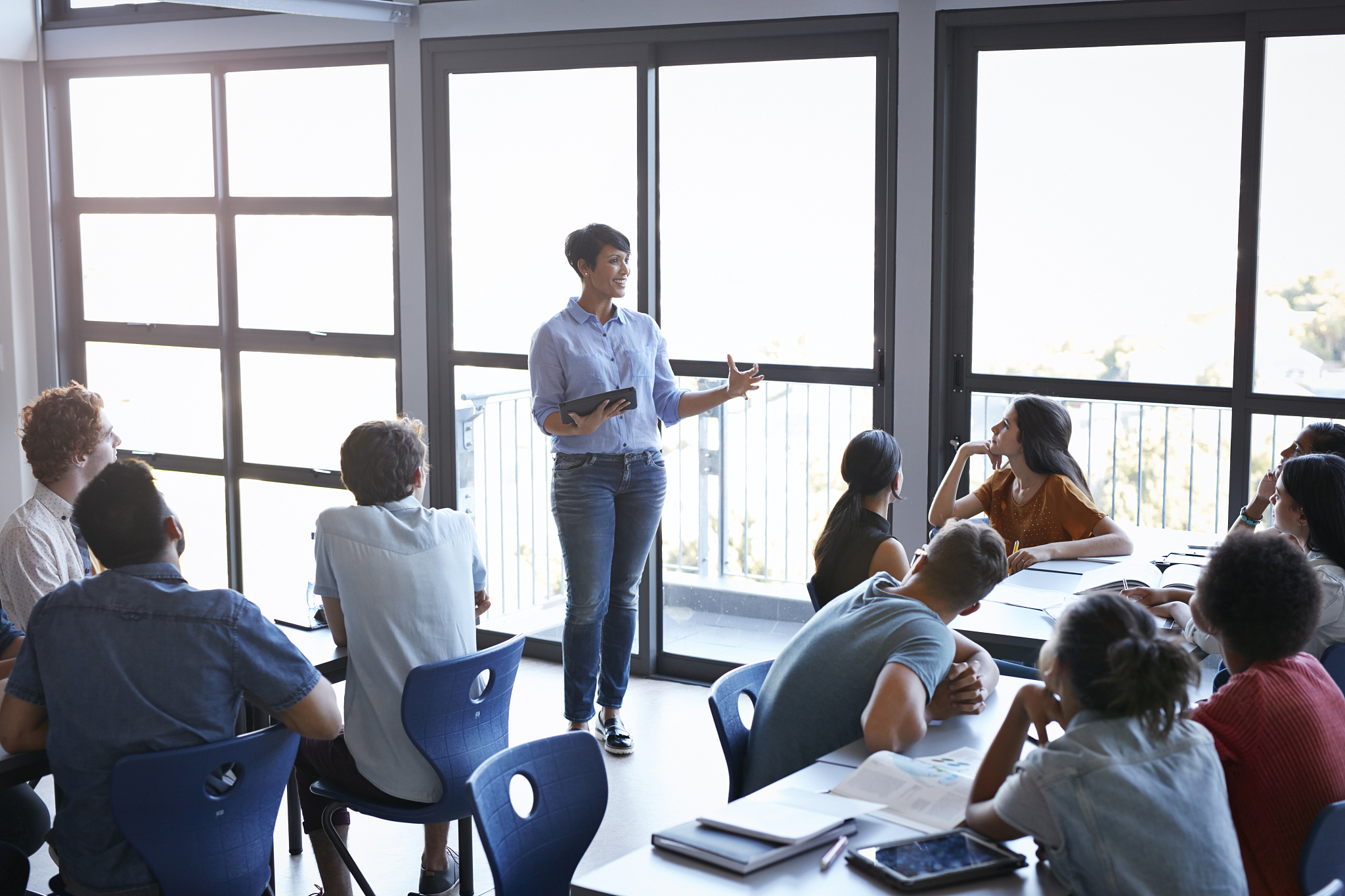 teacher explaining to students in classroom