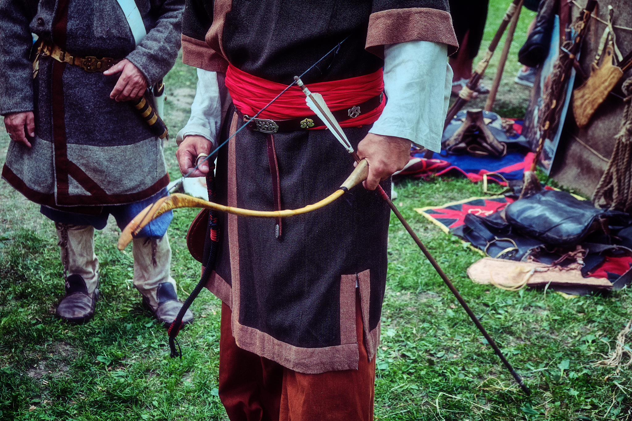 archer retro tribe stands with a bow in his hand. reconstruction