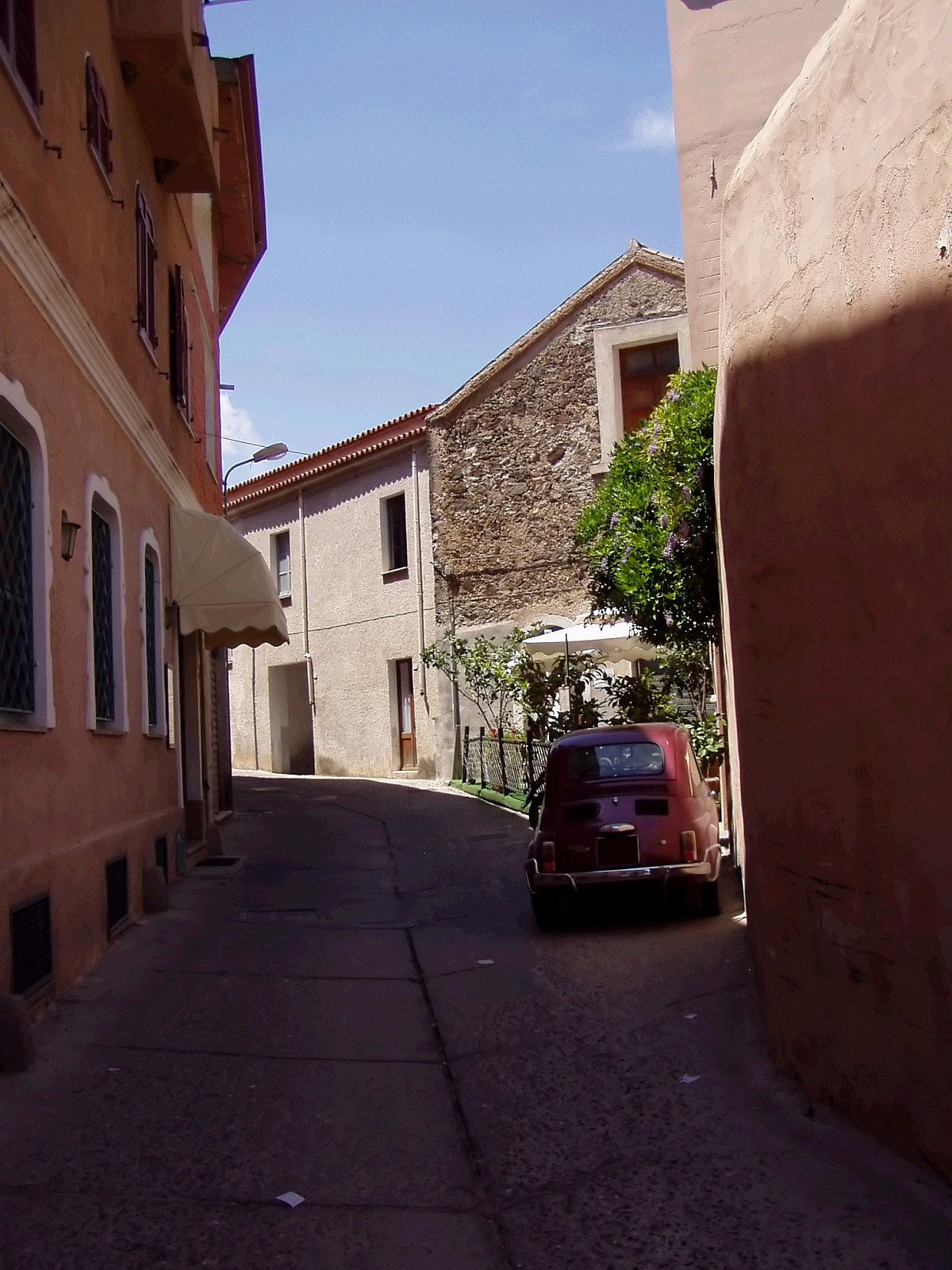 old classic car in narrow street