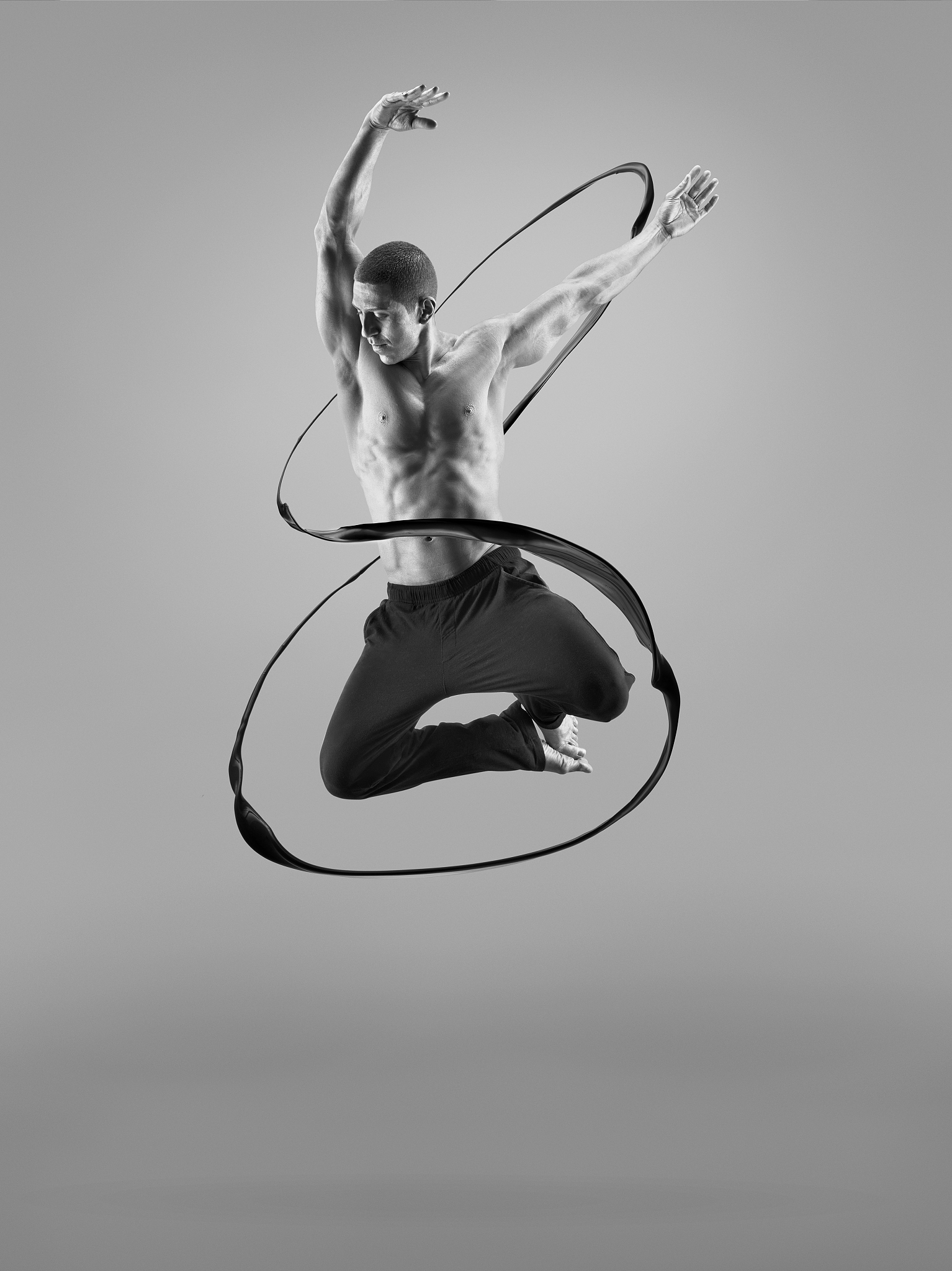 male athlete jumping in liquid splsh