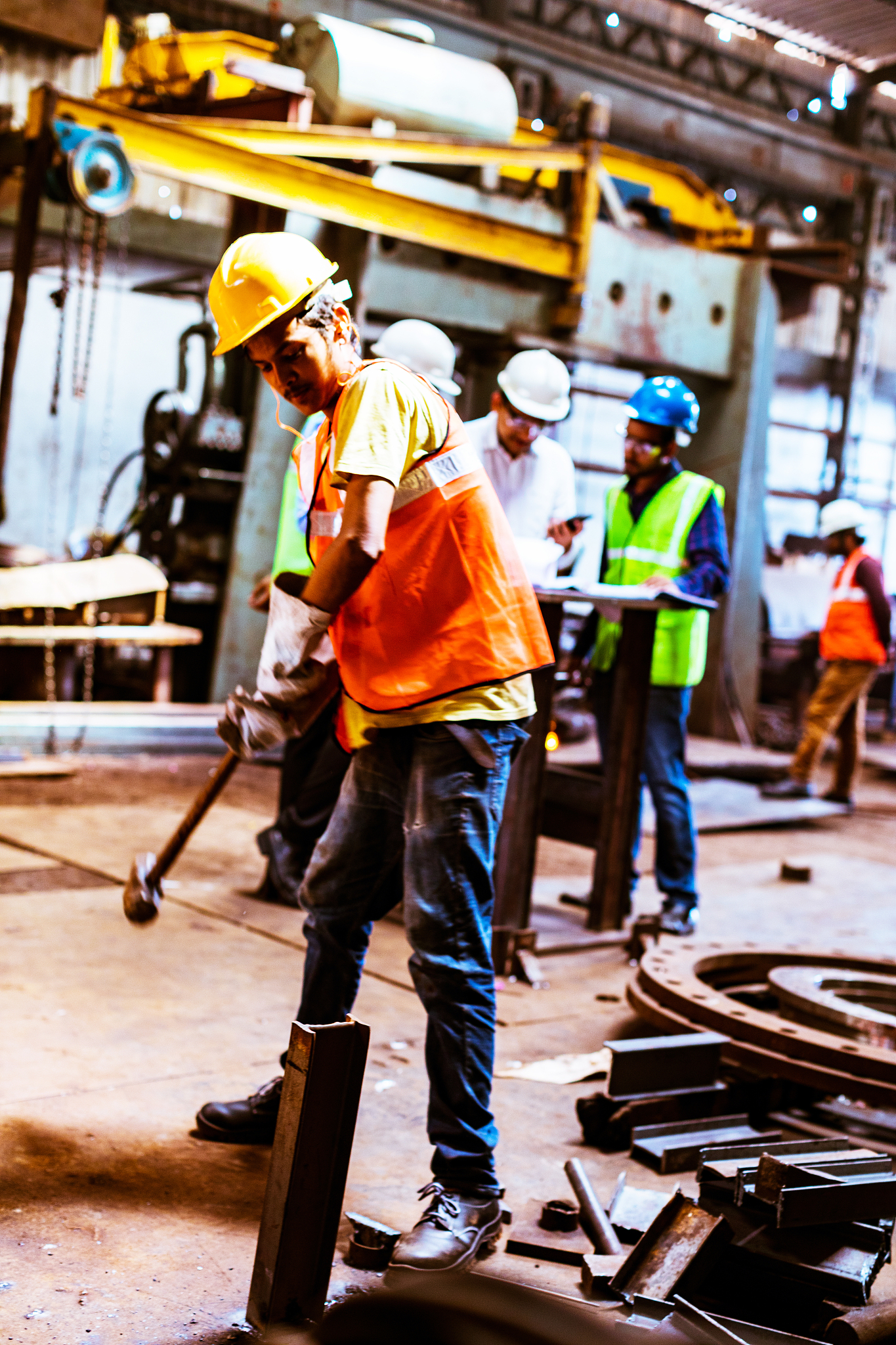 steel industry workers all busy on their tasks