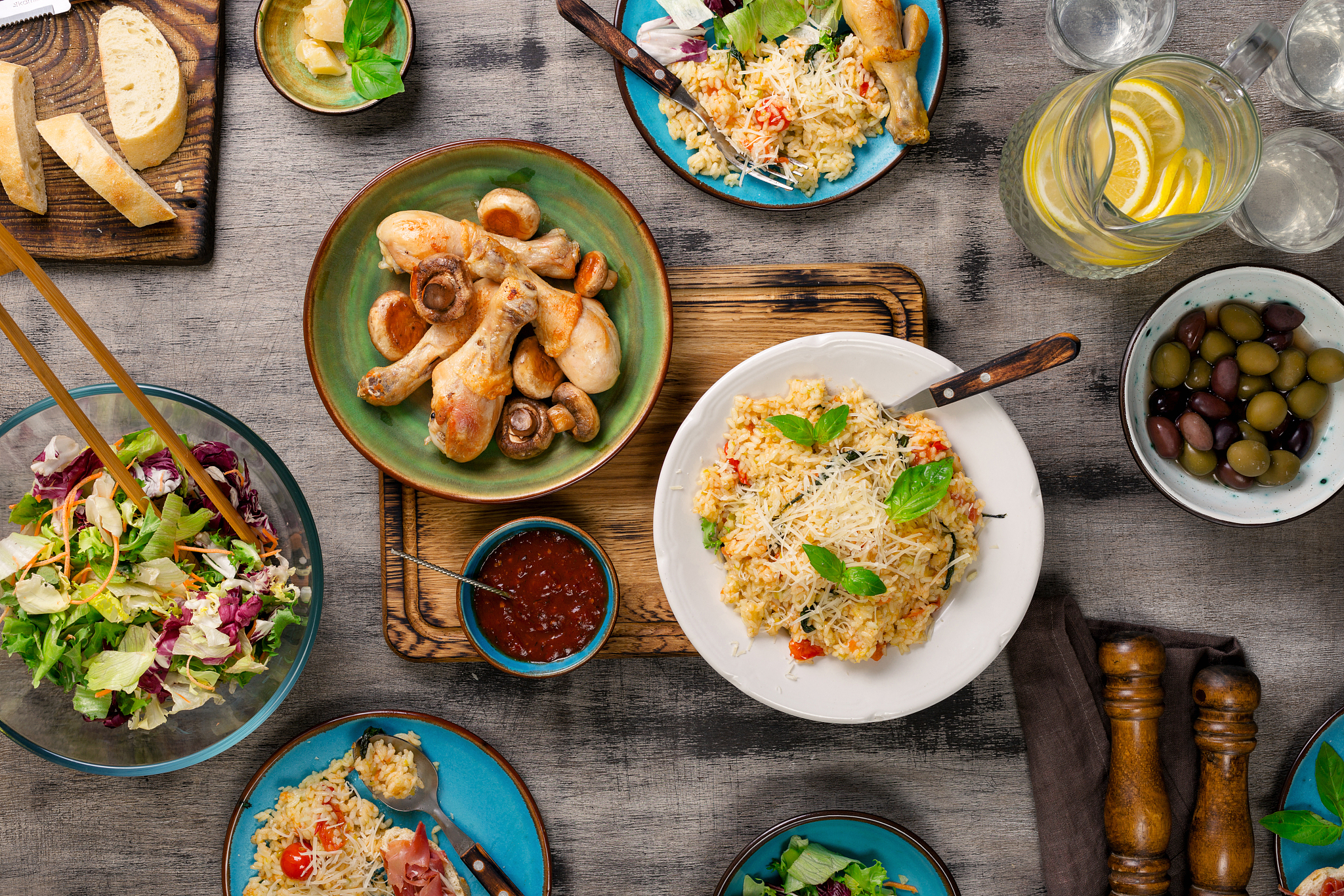 risotto, roasted chicken legs, snacks and lemonade. italian food