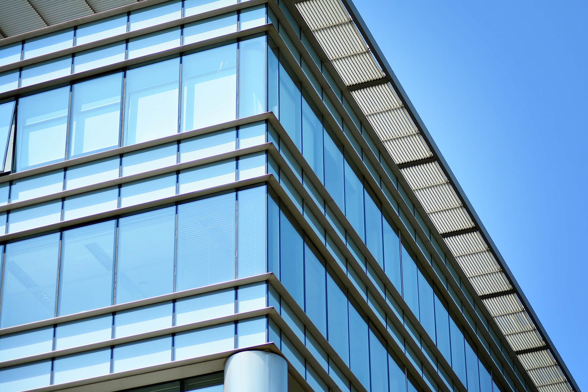 blue clean glass wall of modern office building