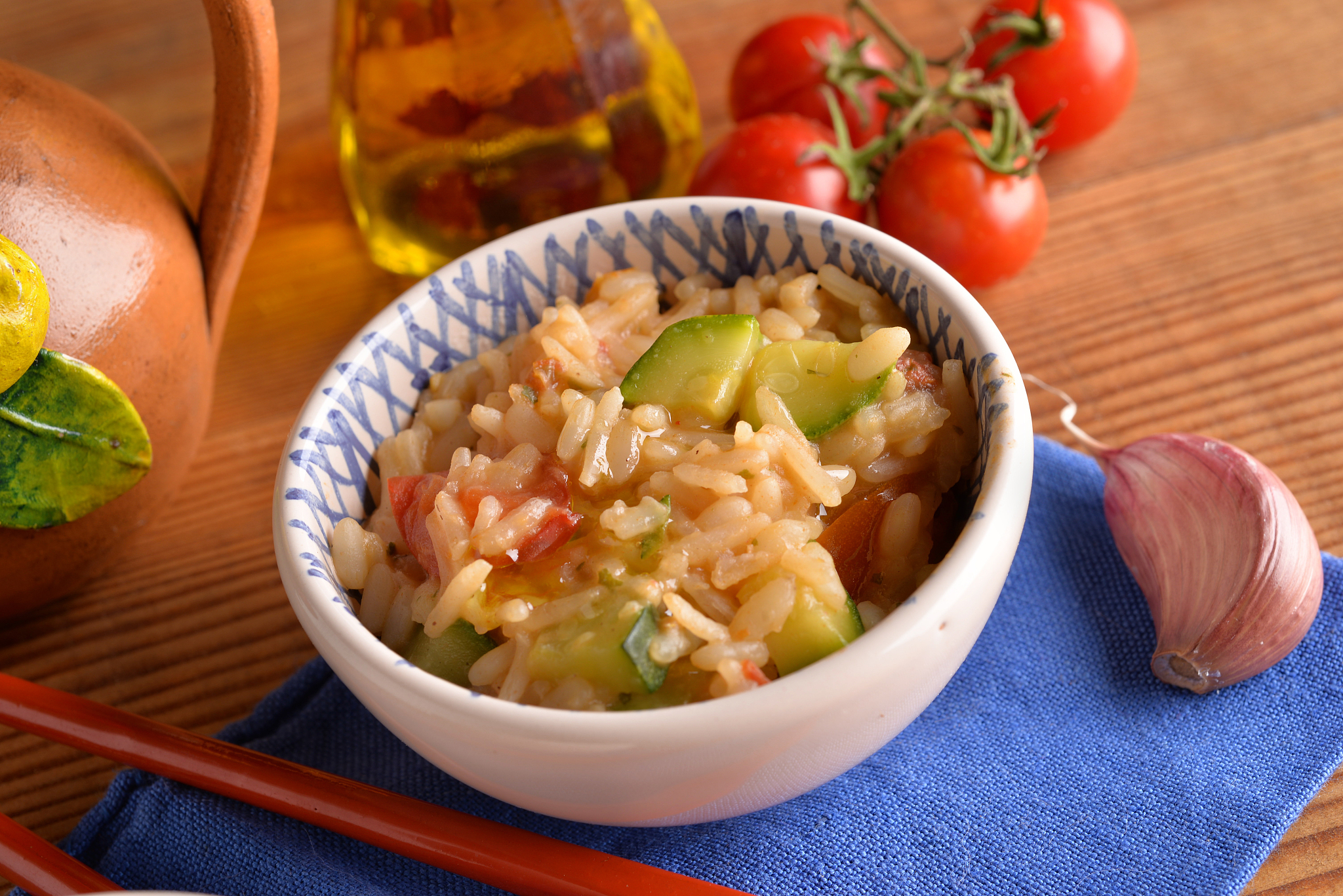bowls of rice with cherry tomatoes and courgettes
