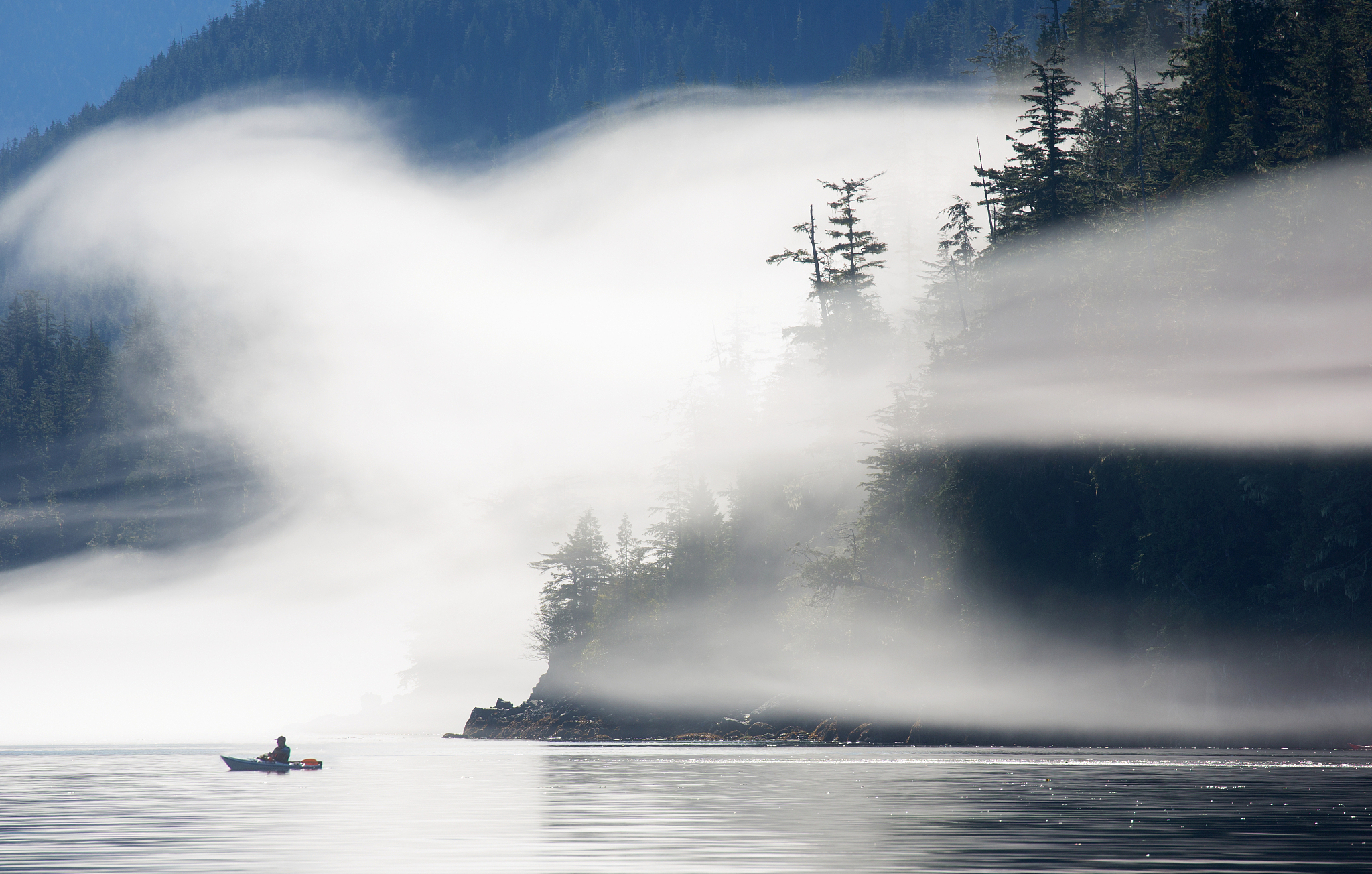 kayaks in morning mist.