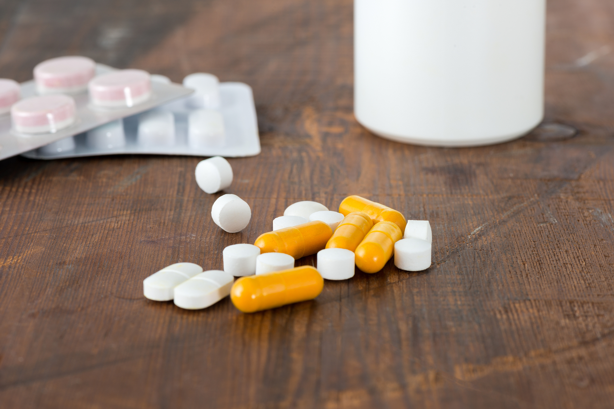 pills and capsules with medicine bottle and blister packaging