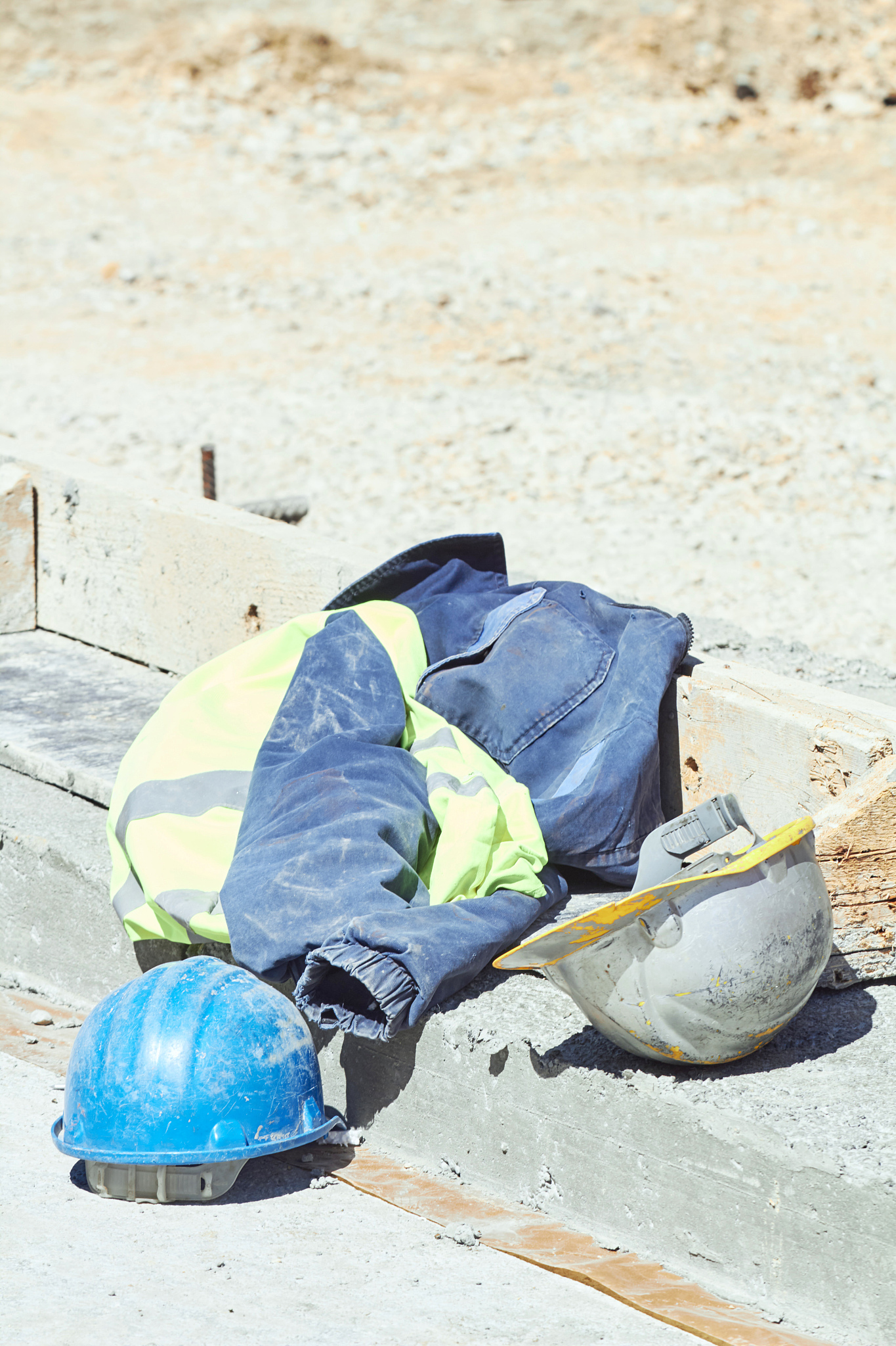 protective helmet and workwear on a construction site.
