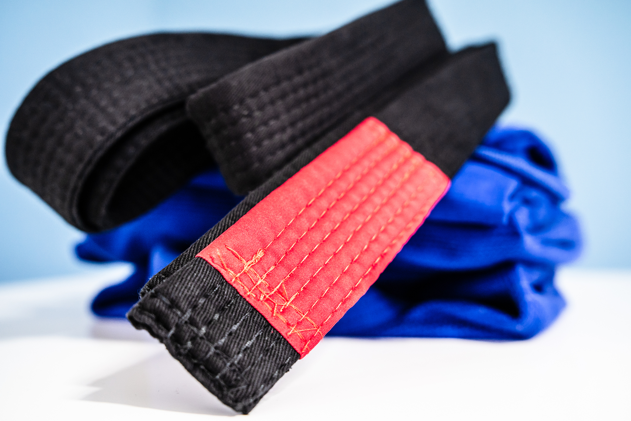 bjj brazilian jiu jitsu black belt and blue kimono gi on the tab