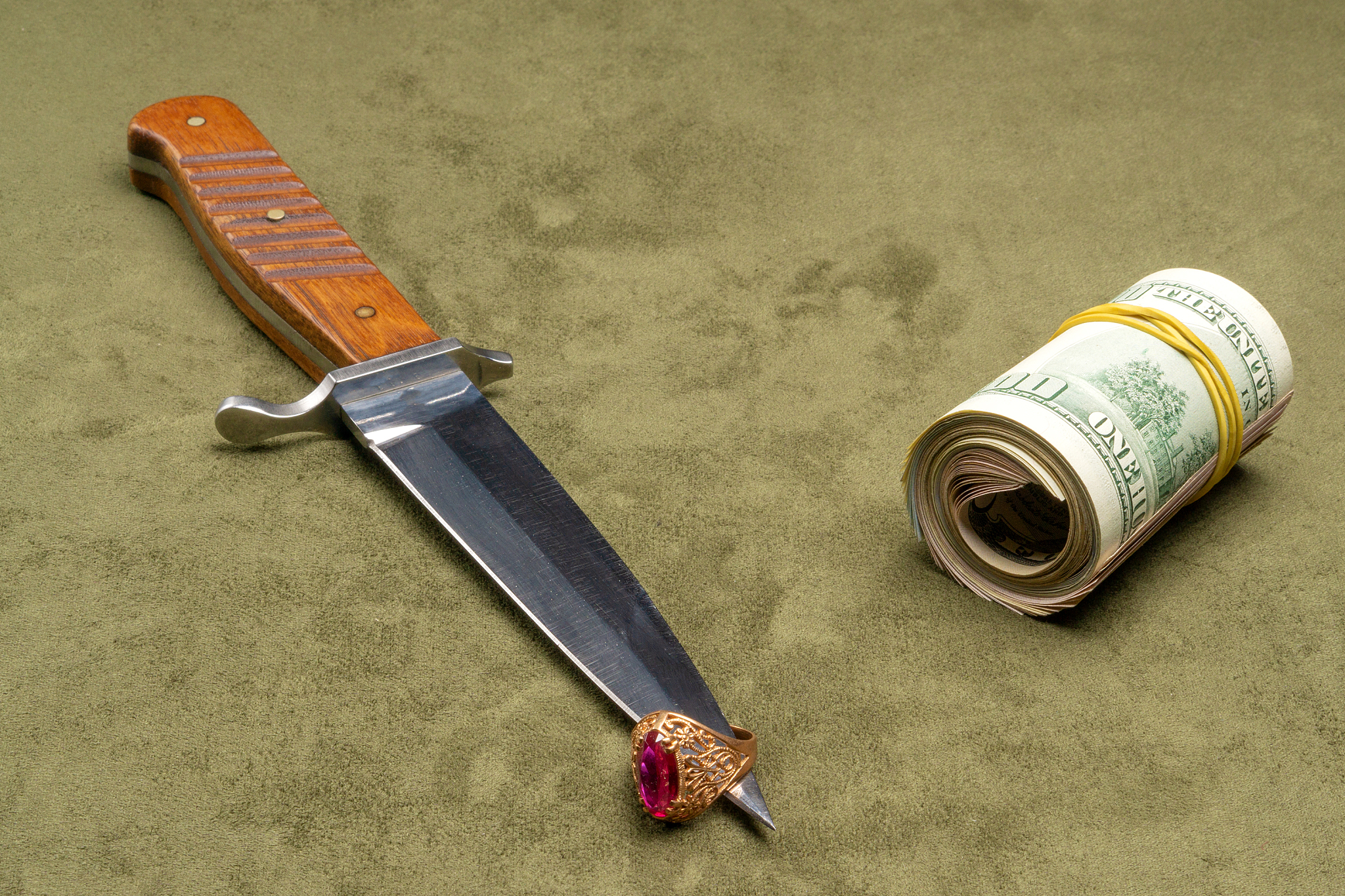dagger and twisted dollars on green background