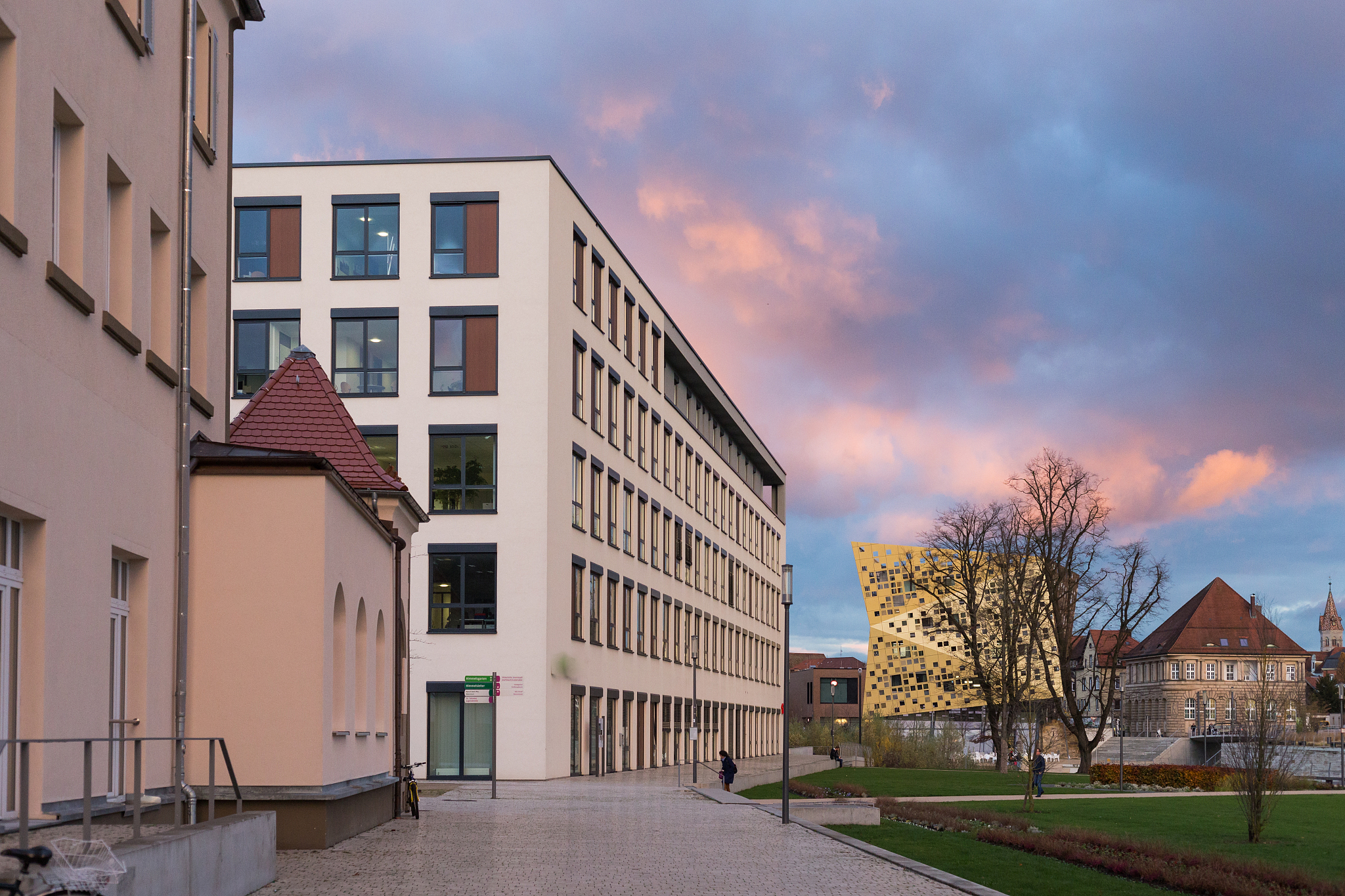 office buildings with sunset autumn colored sky and clouds