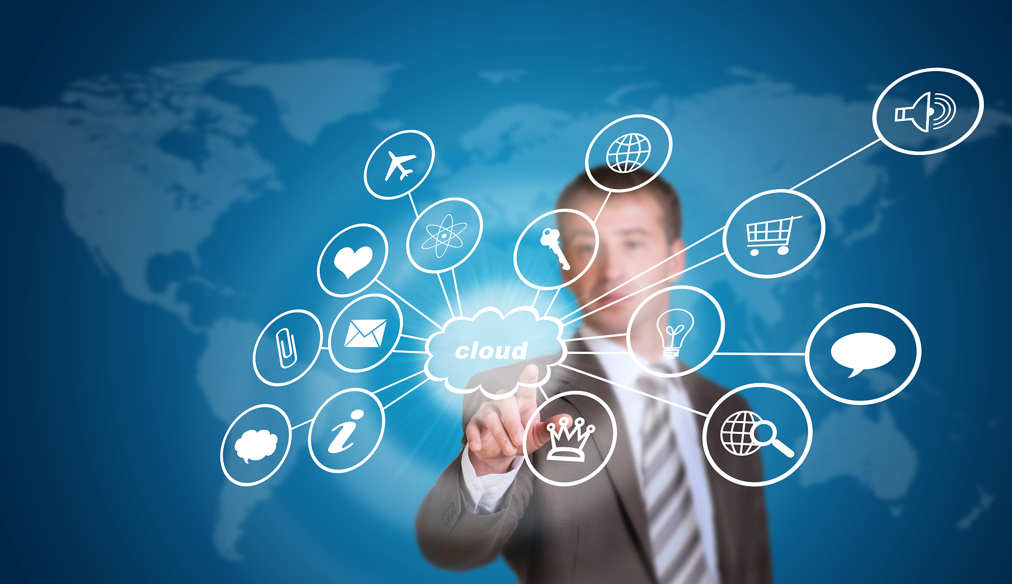 business man pointing her finger at cloud with computer icons