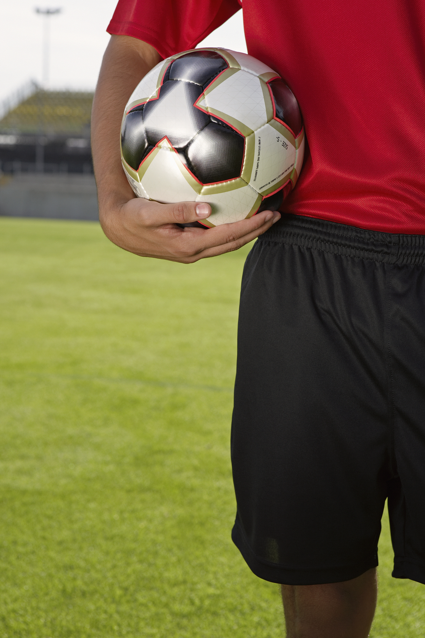 soccer player holding soccer ball