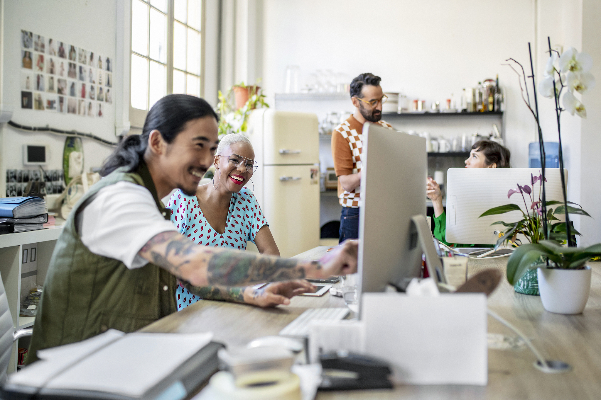 design professionals working on computers at desk