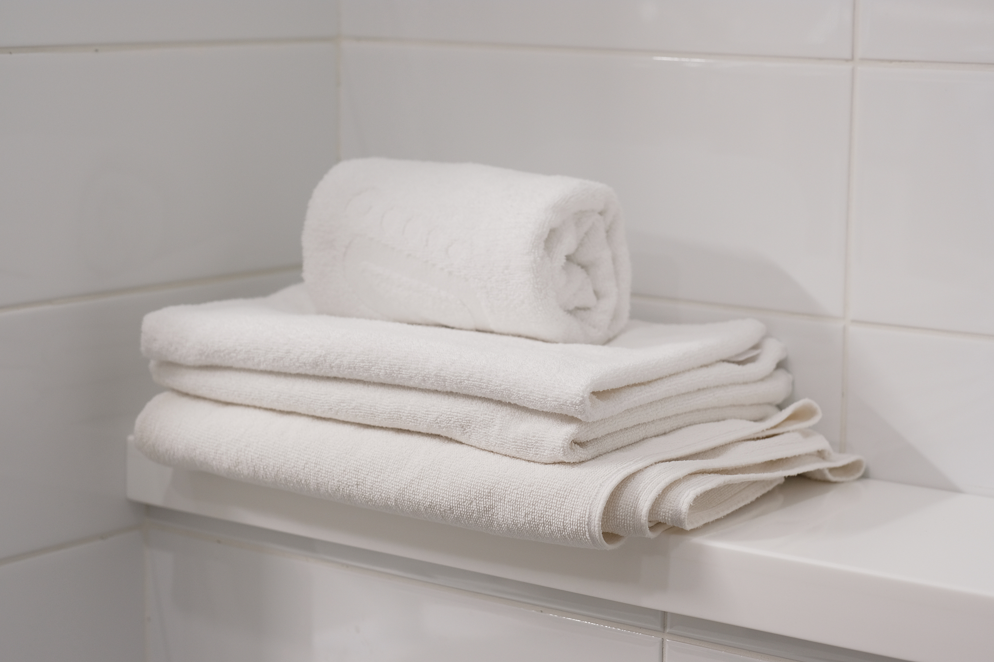 bathroom, towel. white interior of bathroom. details of bathroom