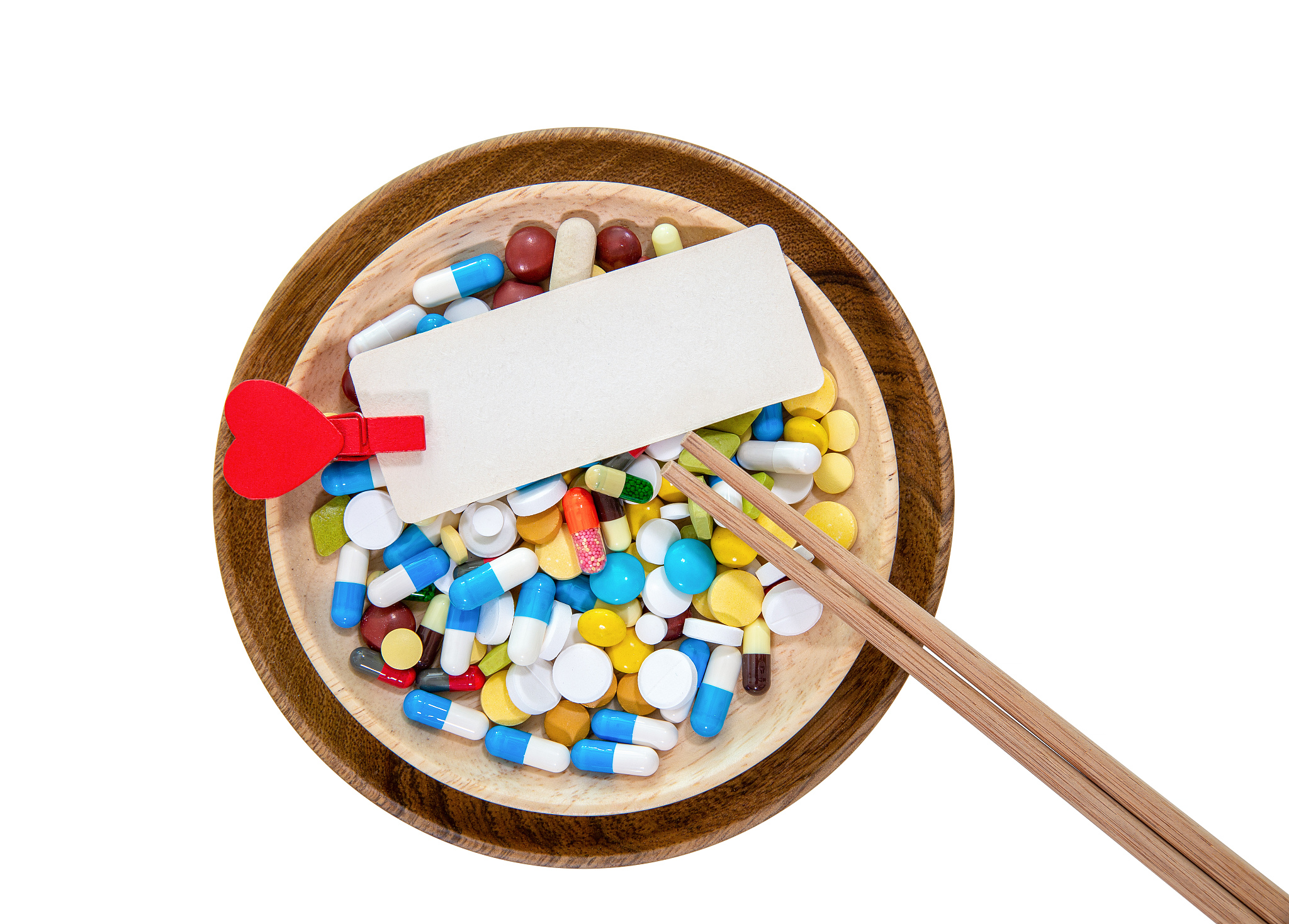 (clipping path) pill and chopsticks isolated on white background