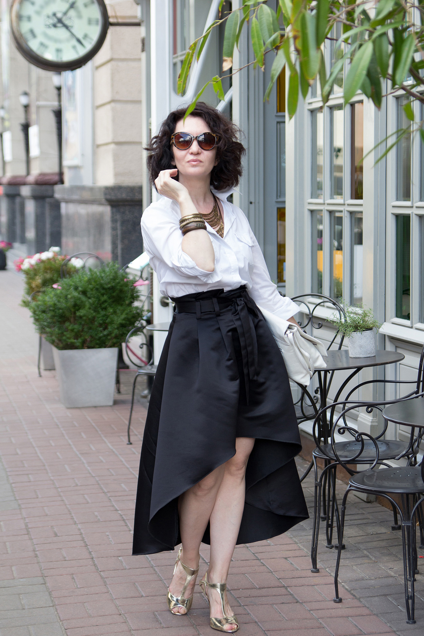 stylish woman in outdoor cafe street style, beautiful woman on a