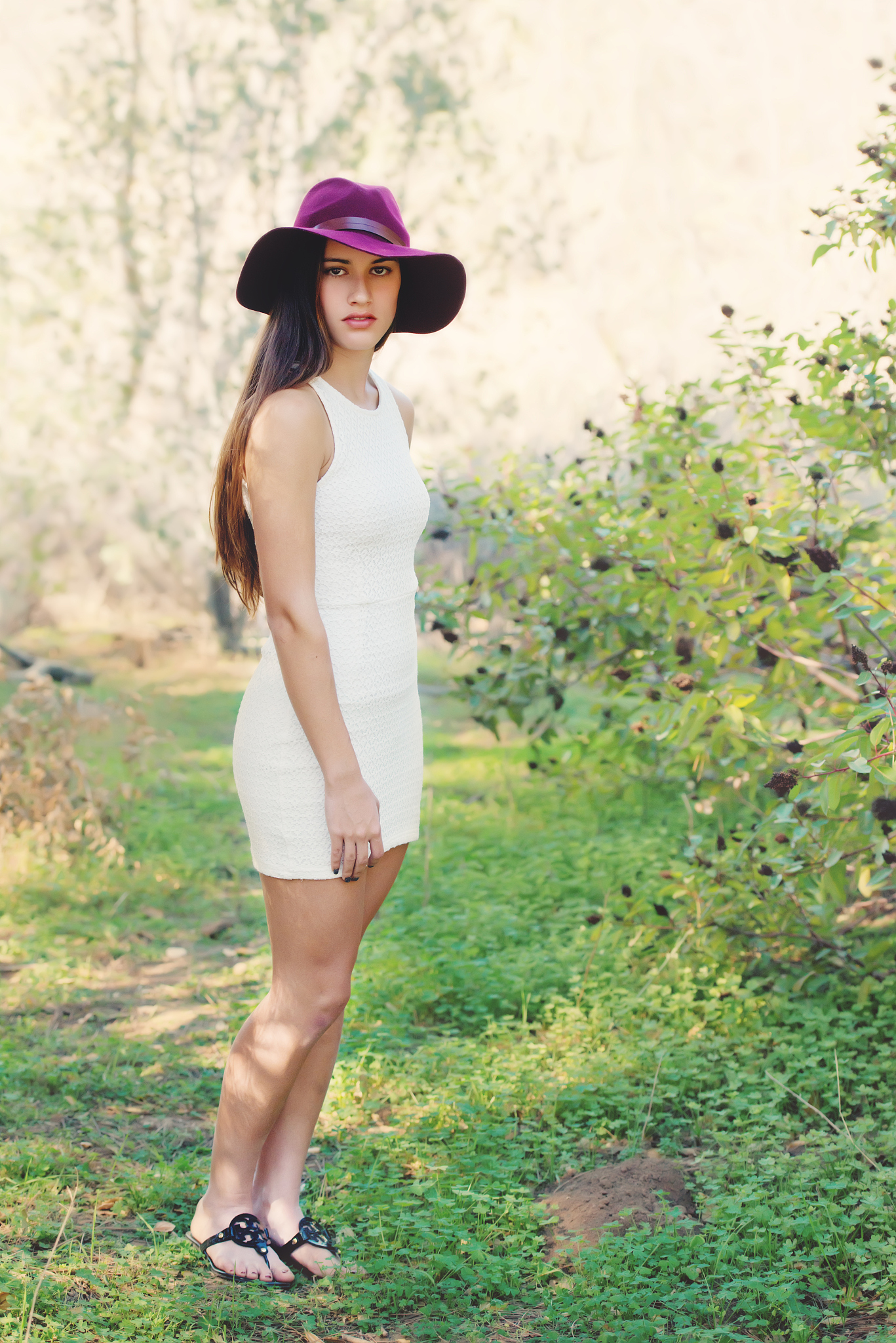 teen girl wearing purple hat