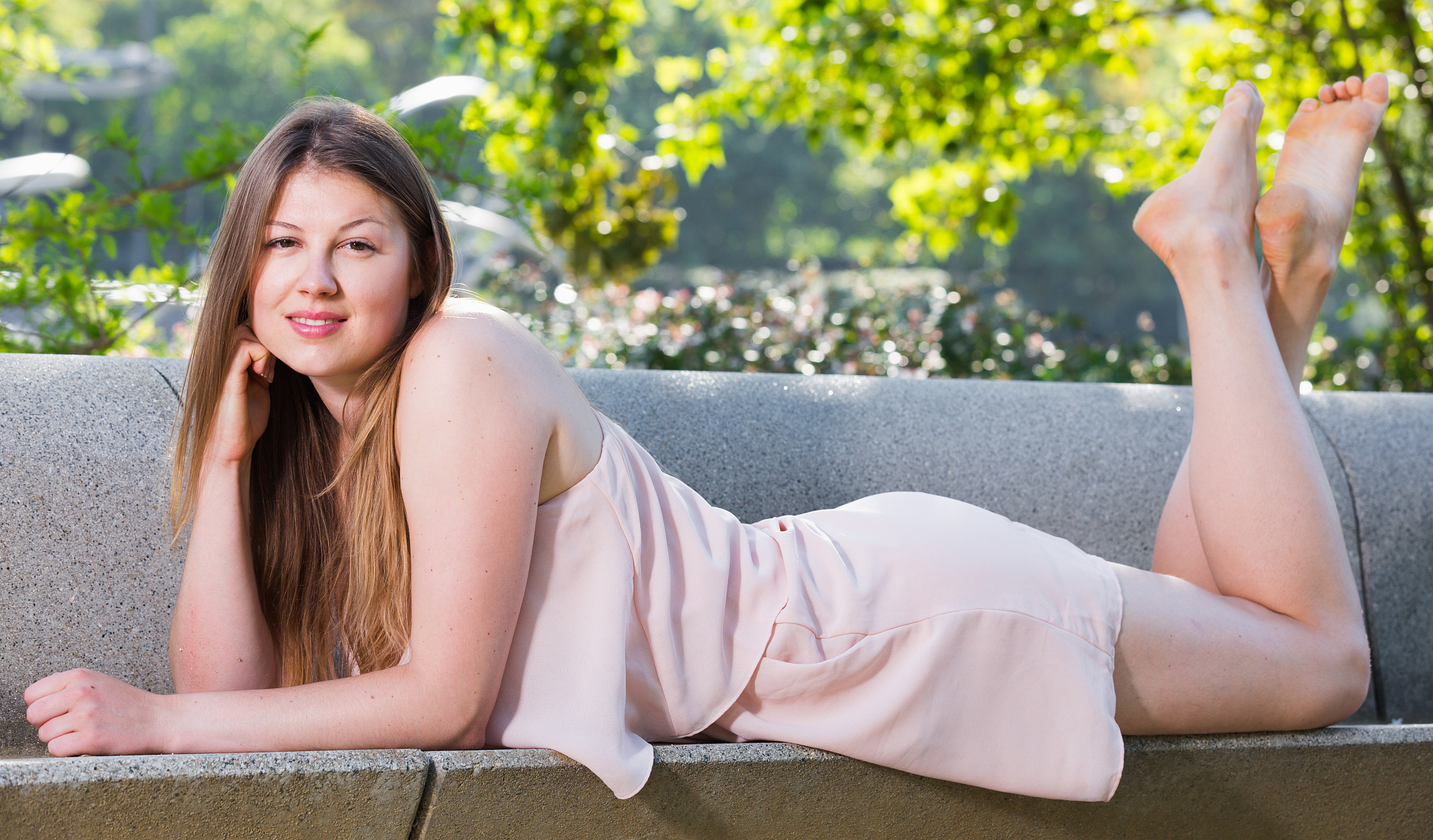 girl is lying on bench in her free time