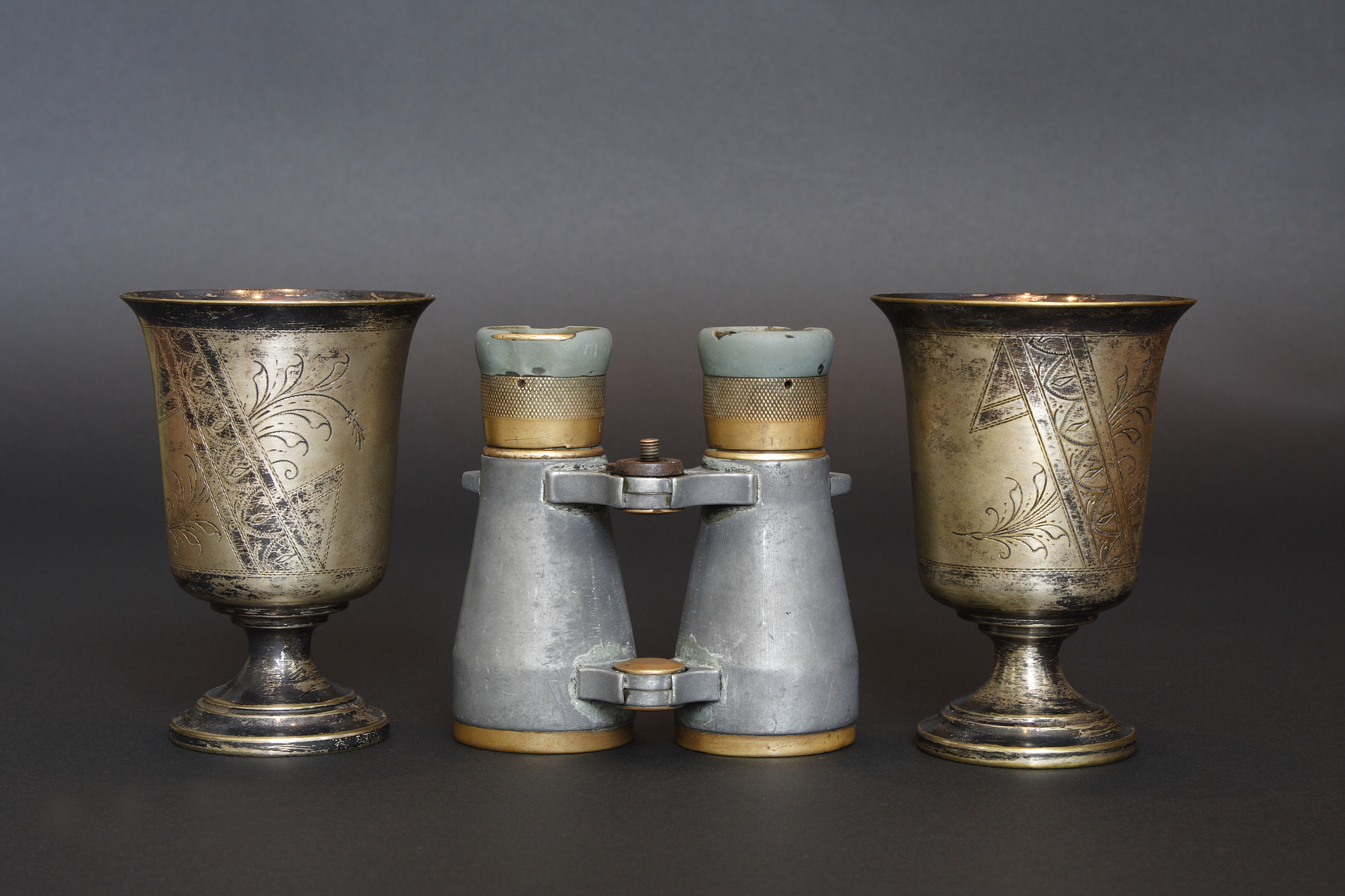 two goblets and binoculars