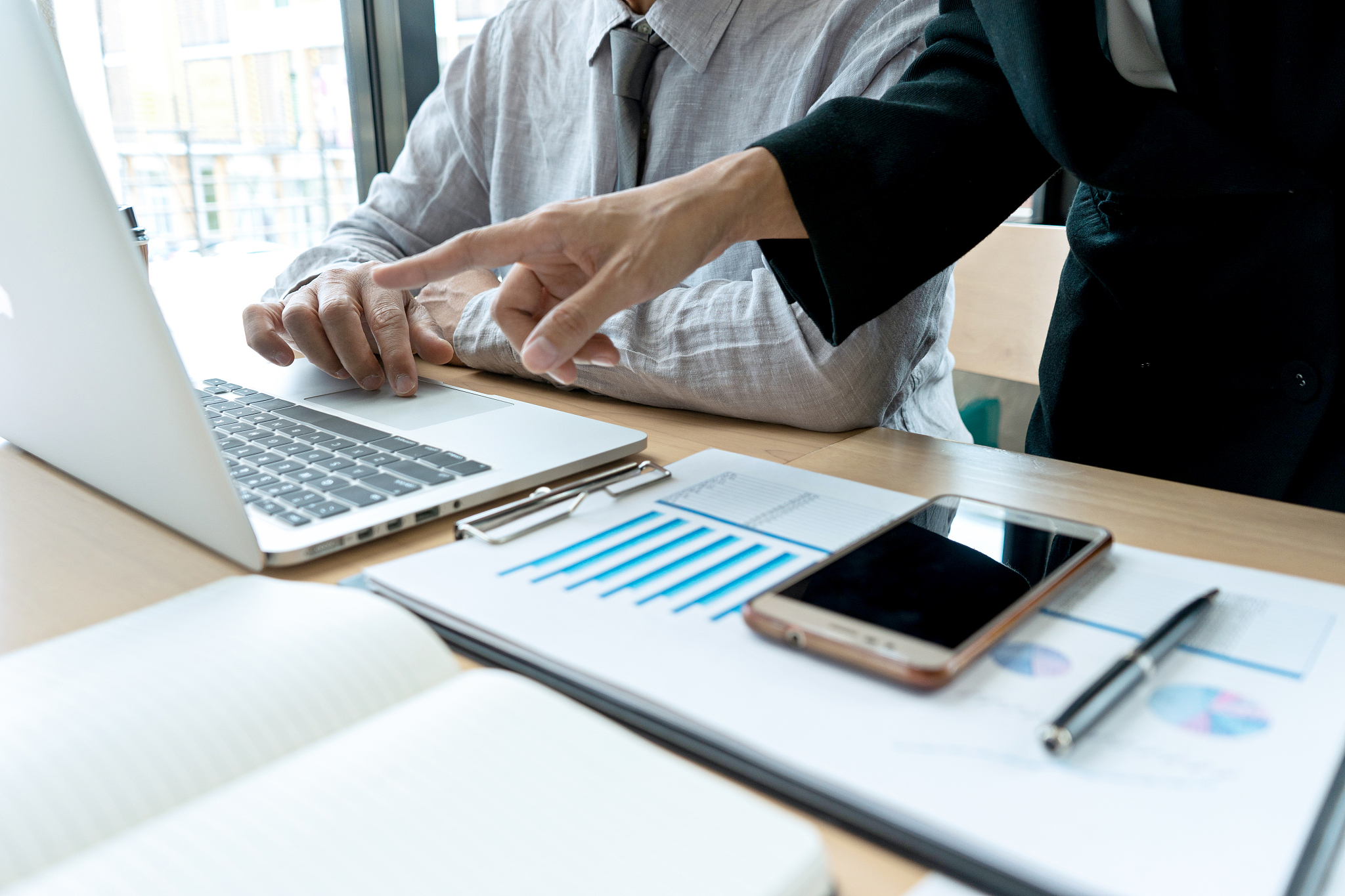 in business office businessman in meeting analyses chart
