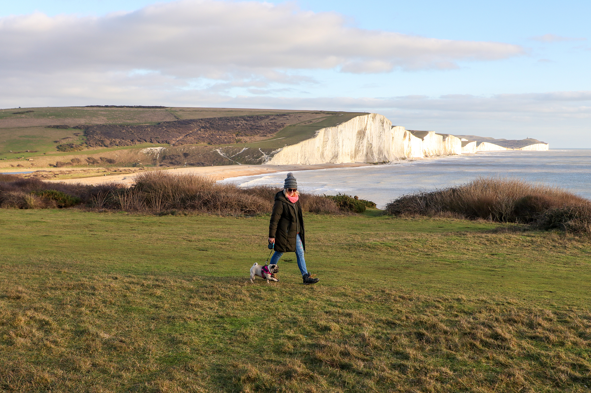 lady walking dog at seven sisters country park