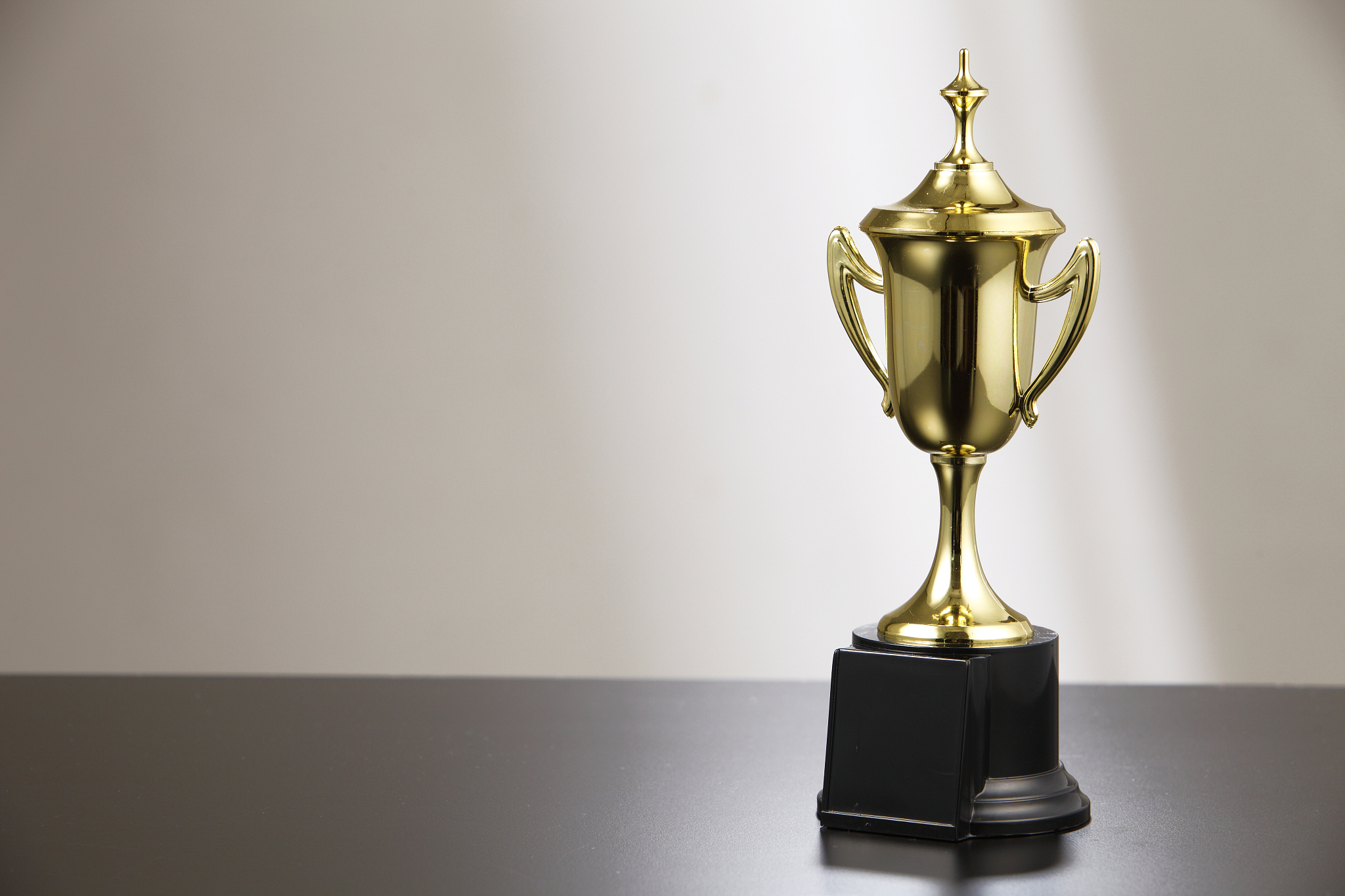 close-up of award on table against wall