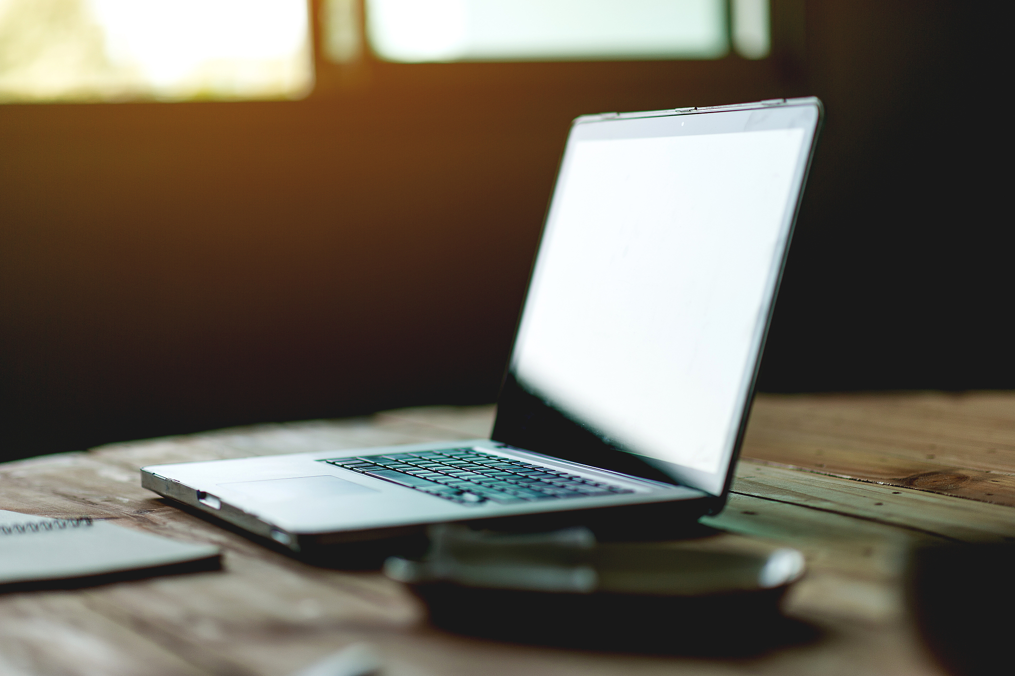 a desk with a business computer and a note on the desk. business