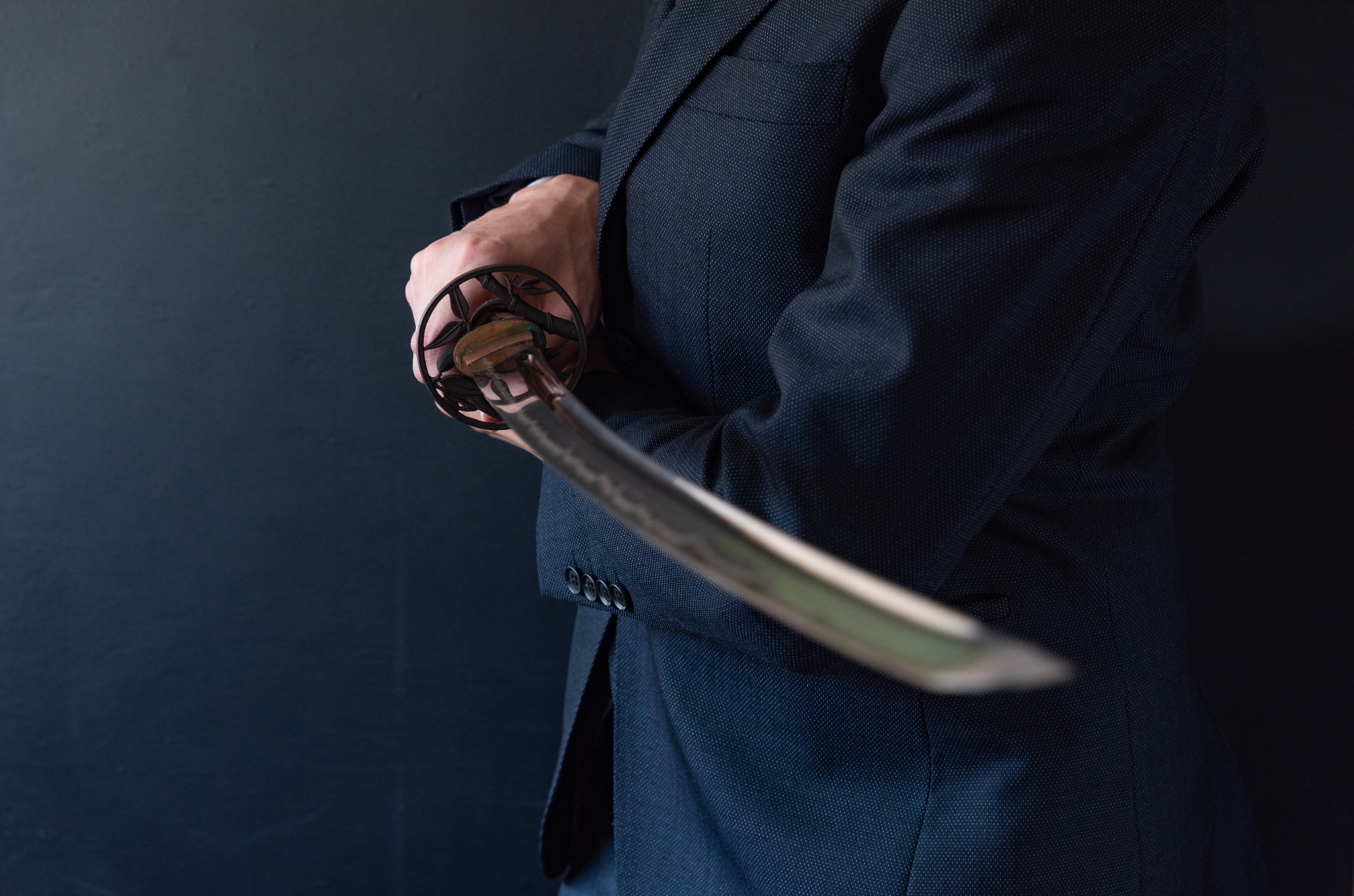 the man holding japanese sword
