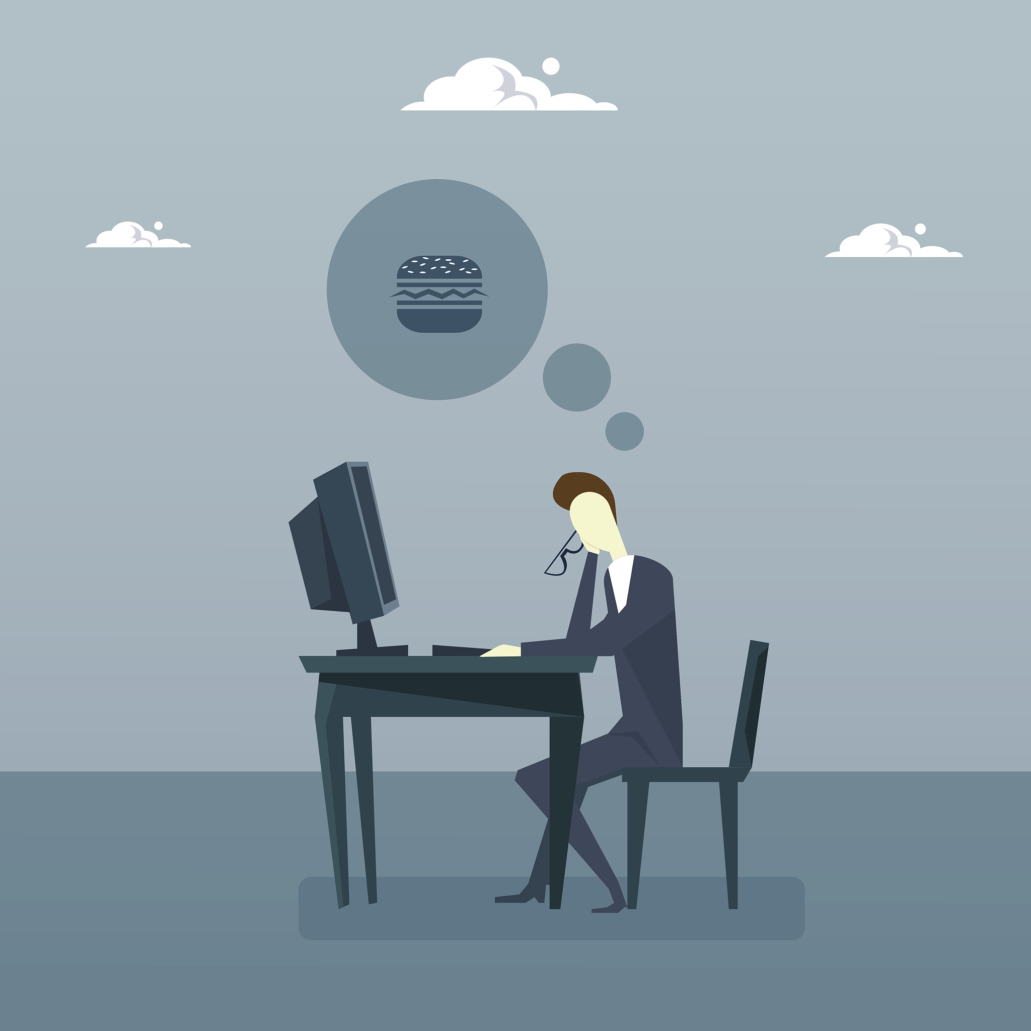 tired business man working on computer thinking about lunch coff