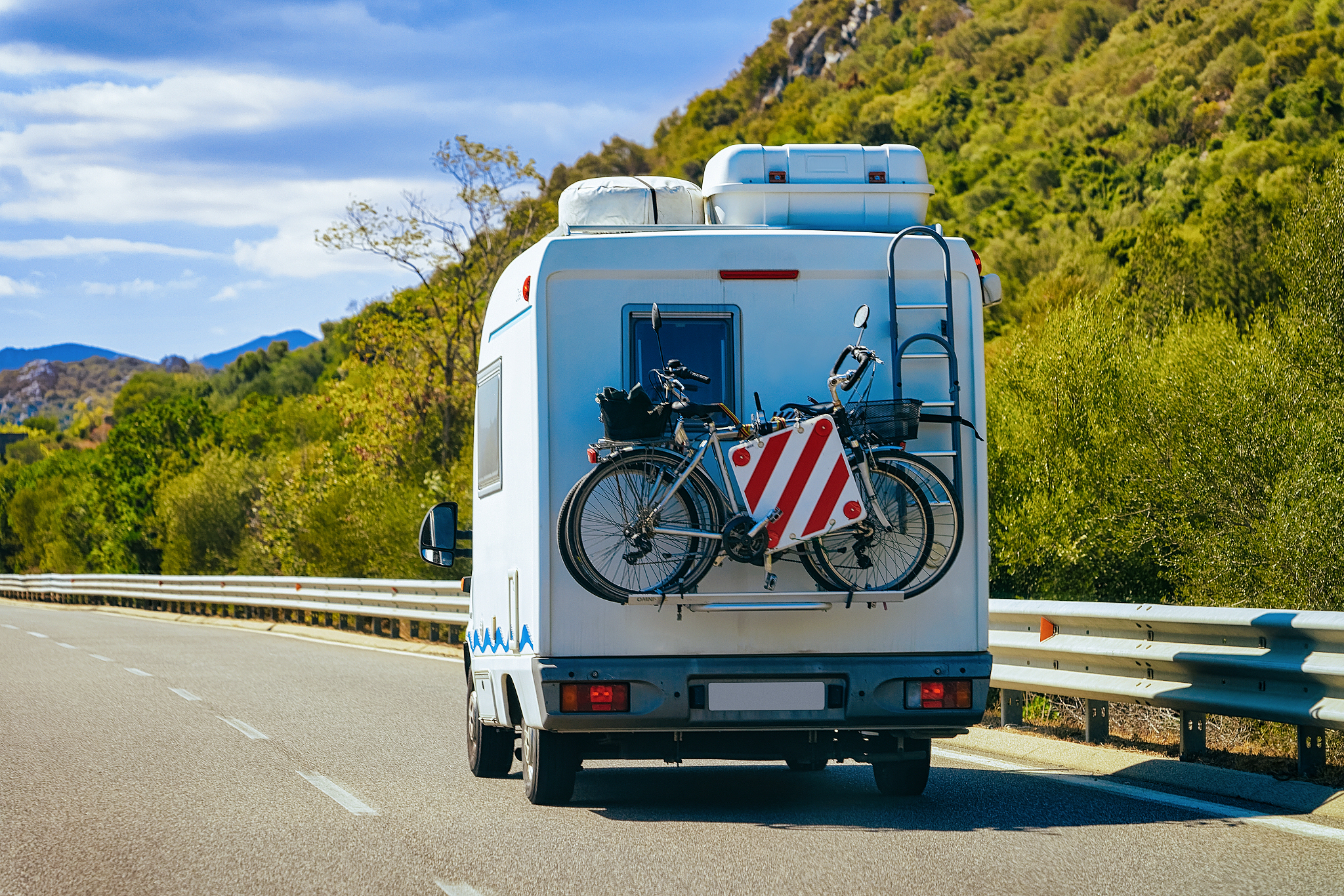 rv cavaran with bicycles on road in costa smeralda sardinia