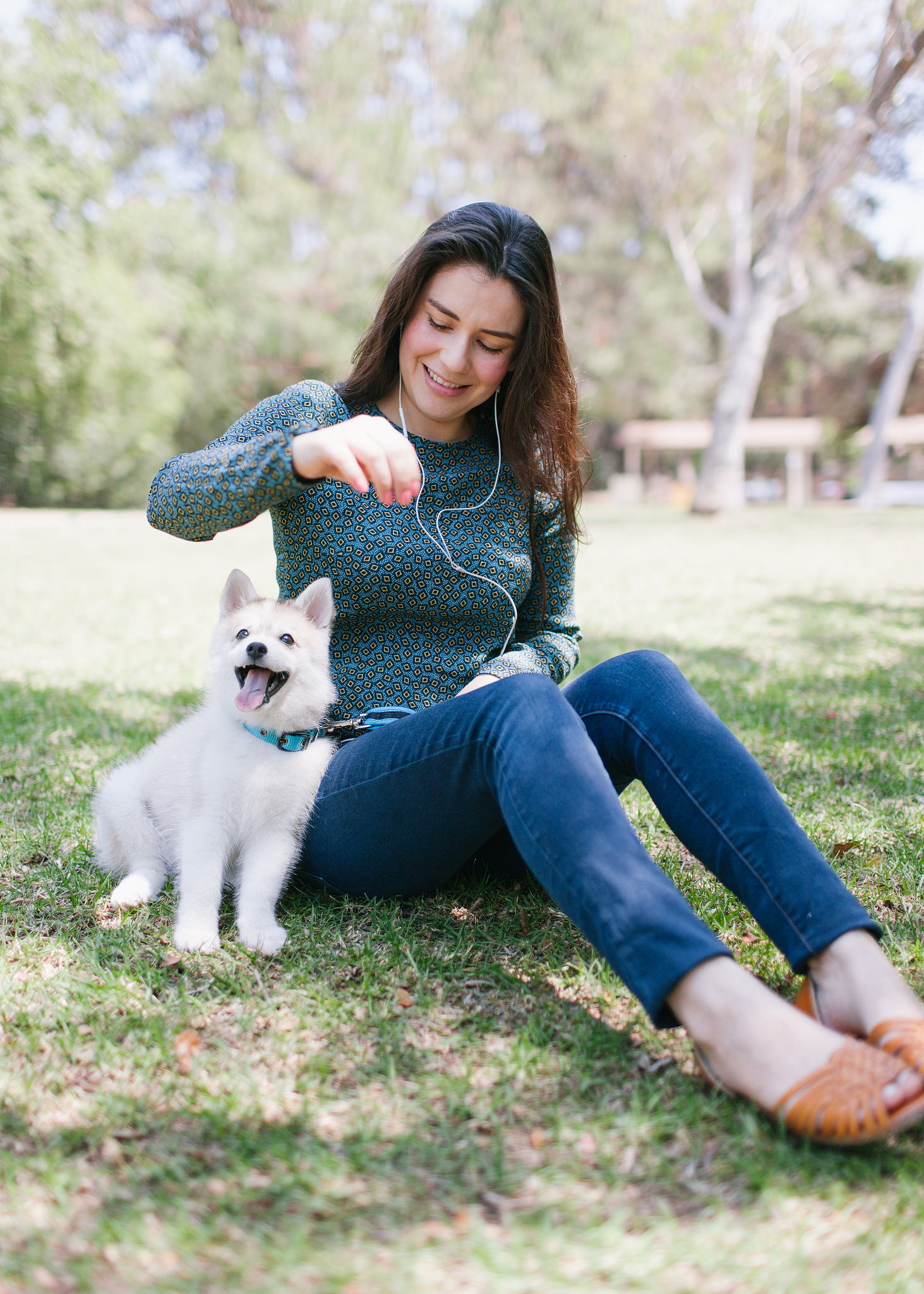 woman playing with dog
