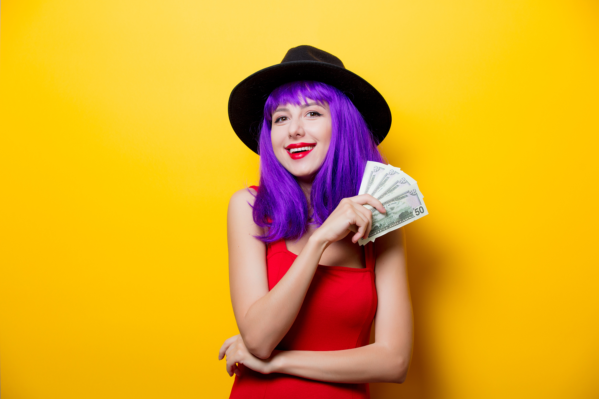 hipster girl with purple hairstyle with money