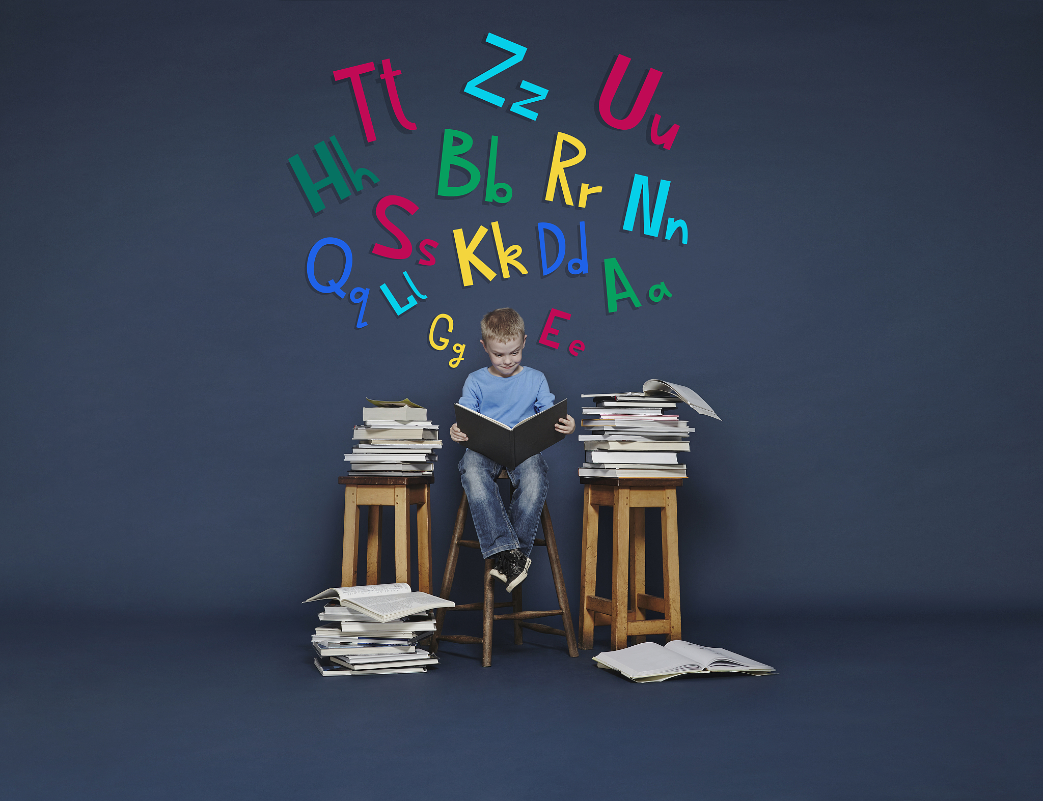 boy reading books. cartoon letters