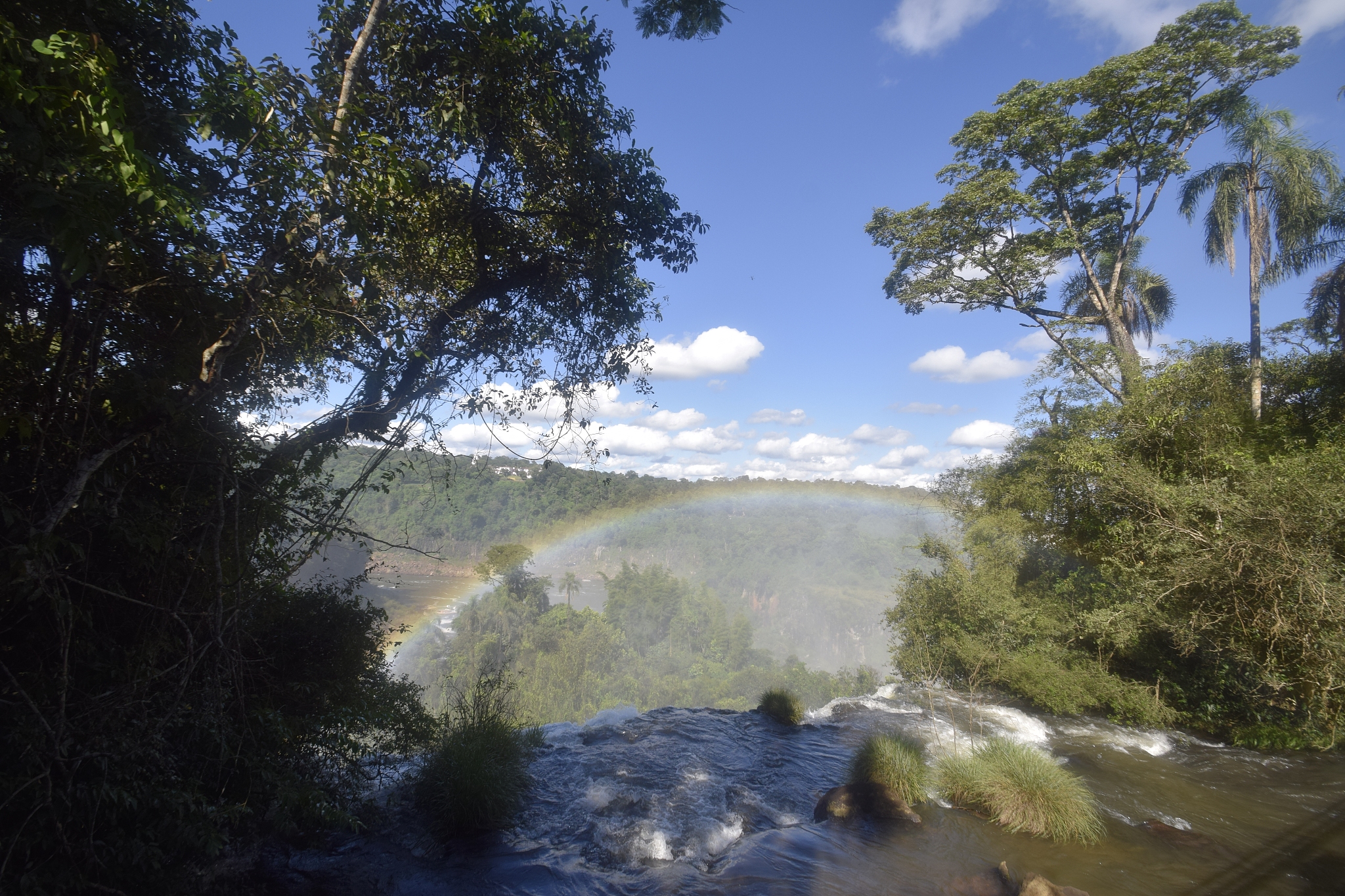 rainbow over the iguacu waterfalls seen from the argentinian sid