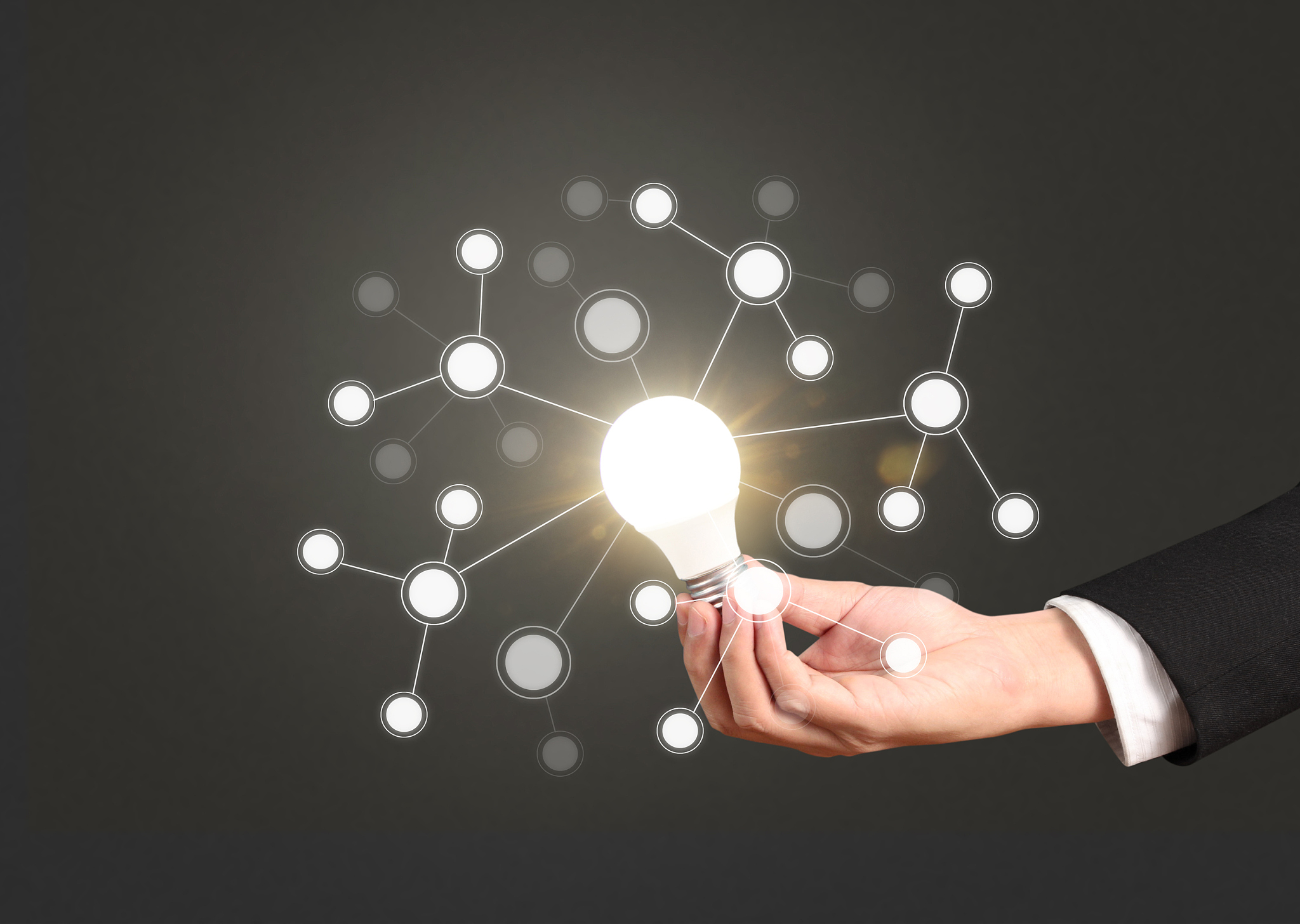 holding lightbulb in  hand