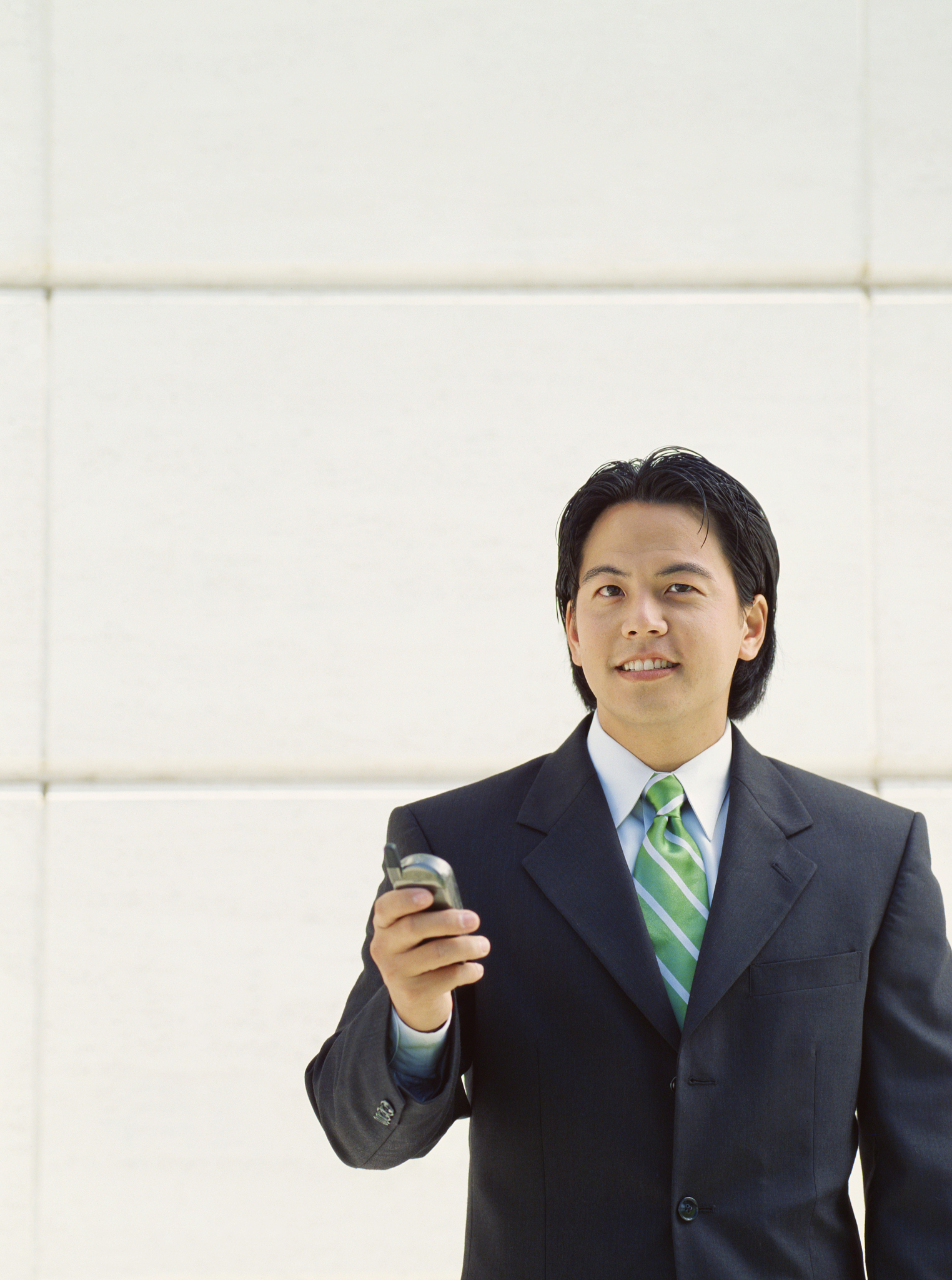 businessman holding a mobile phone