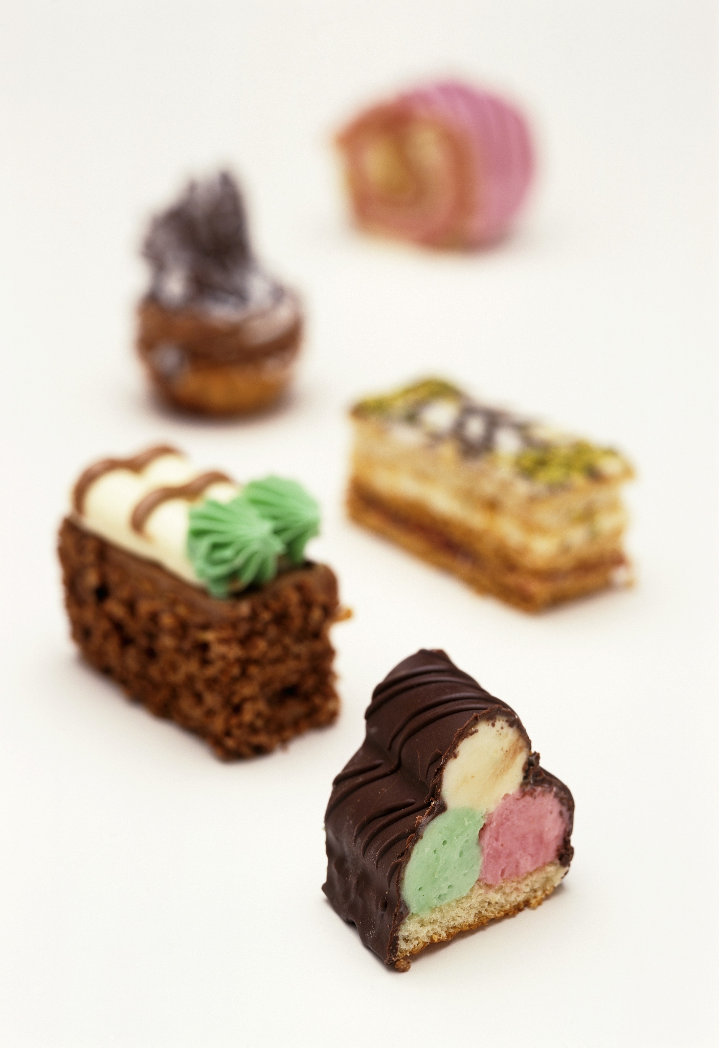 small cakes with colourful decorations
