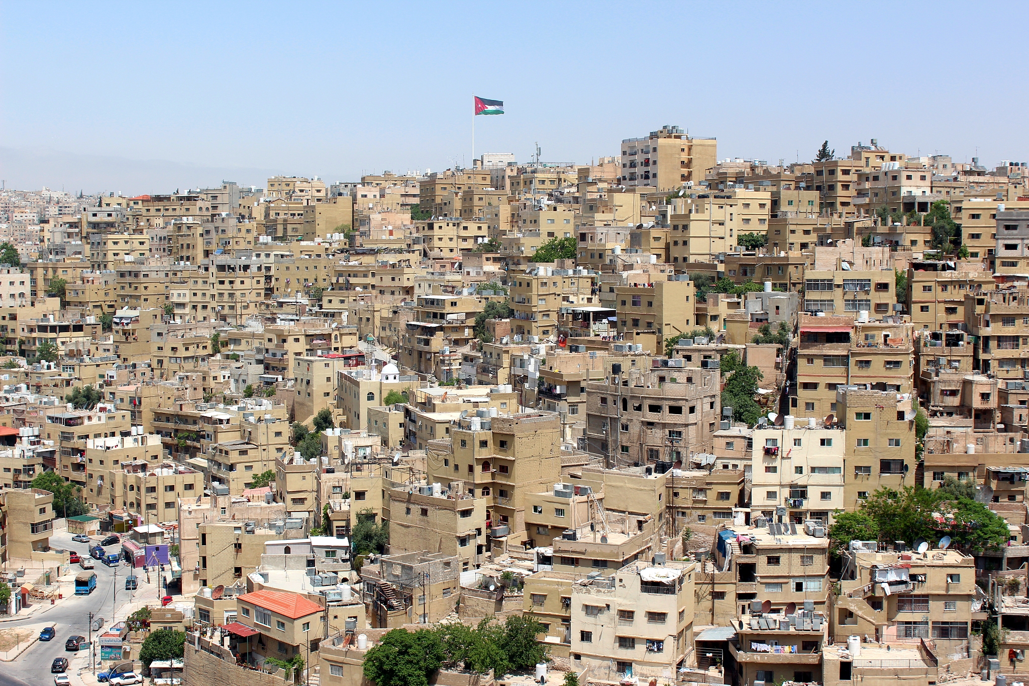 amman city view with big jordan flag, amman