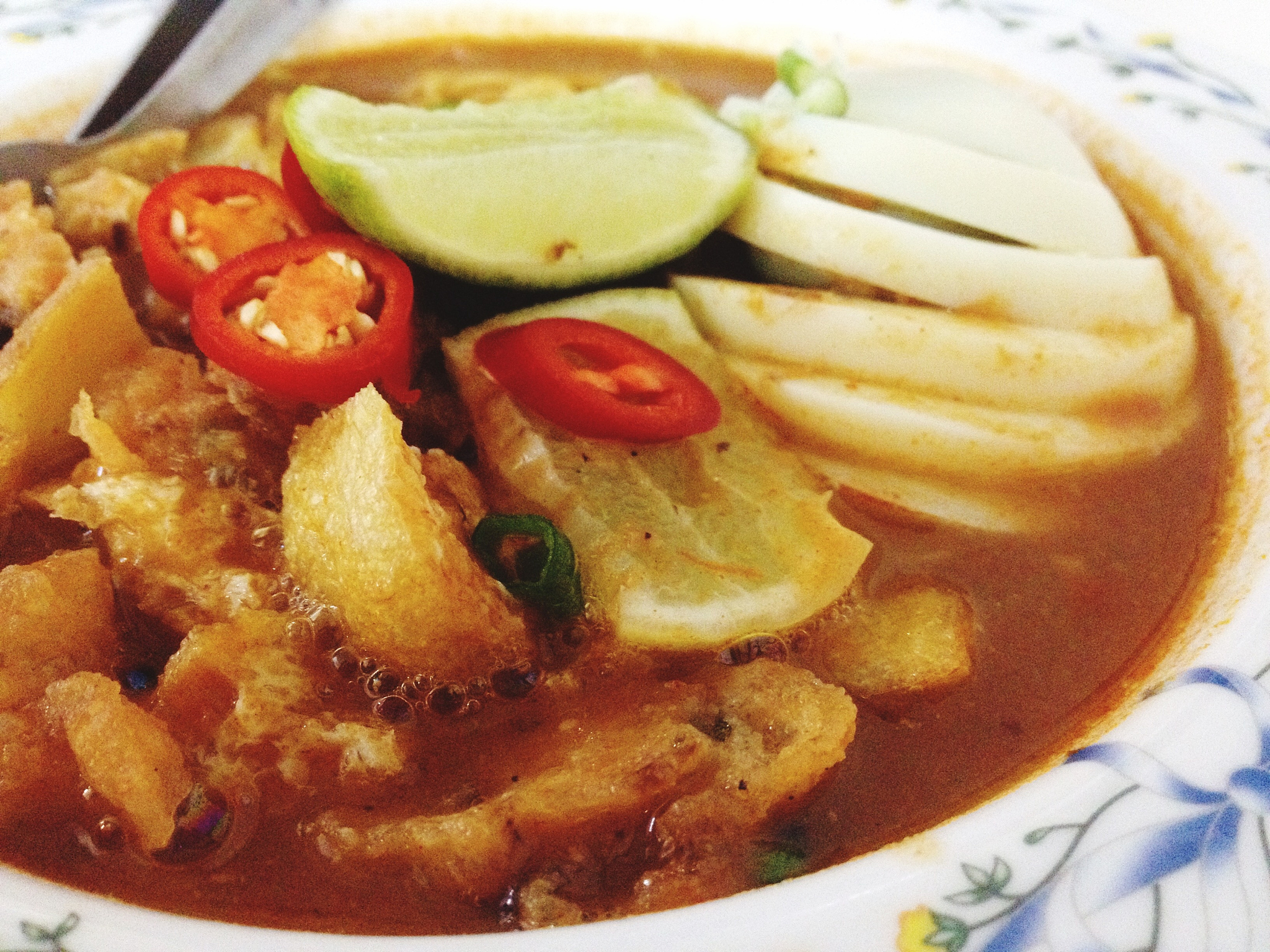 close up of vegetables with egg in gravy
