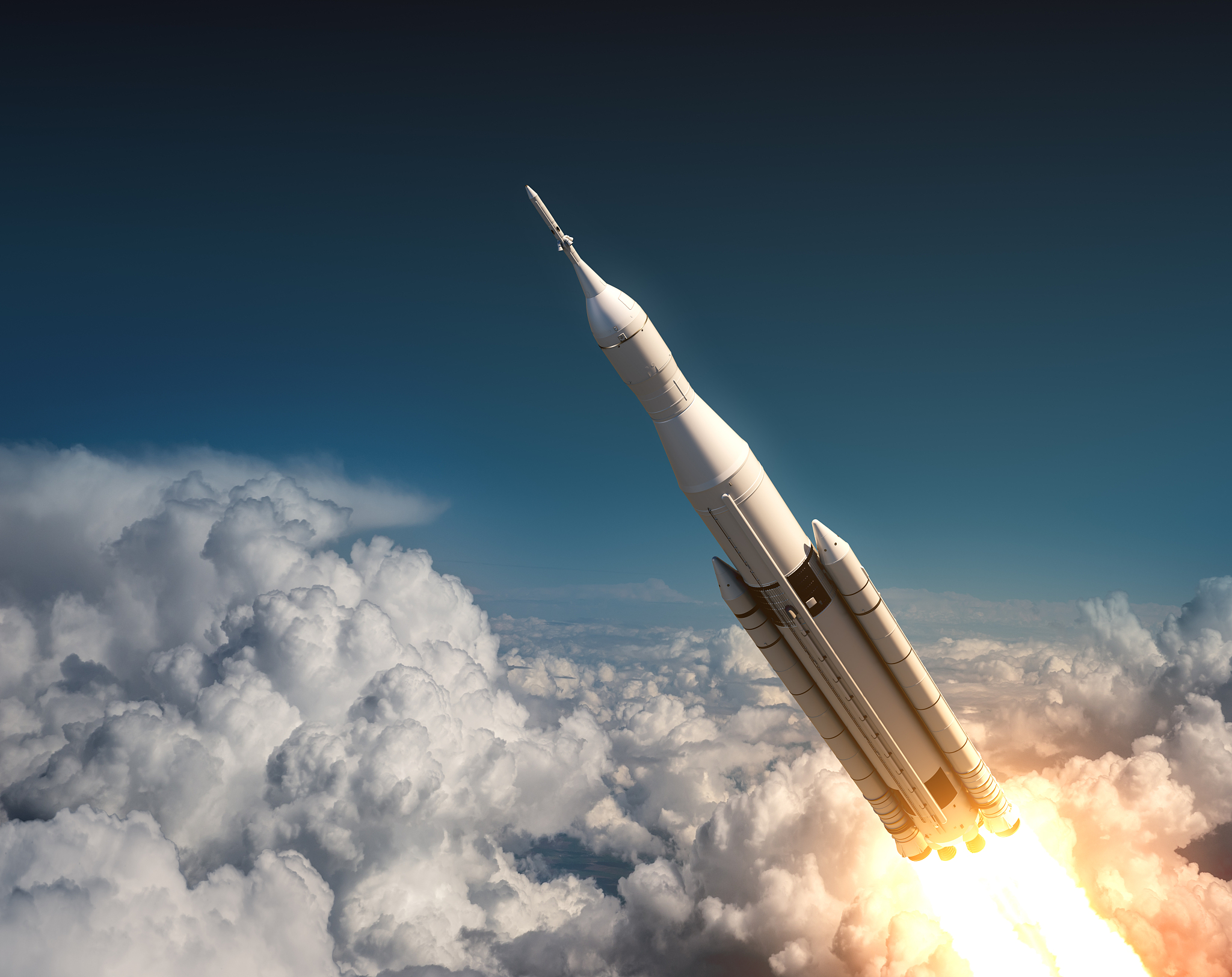 space launch system flying in the clouds